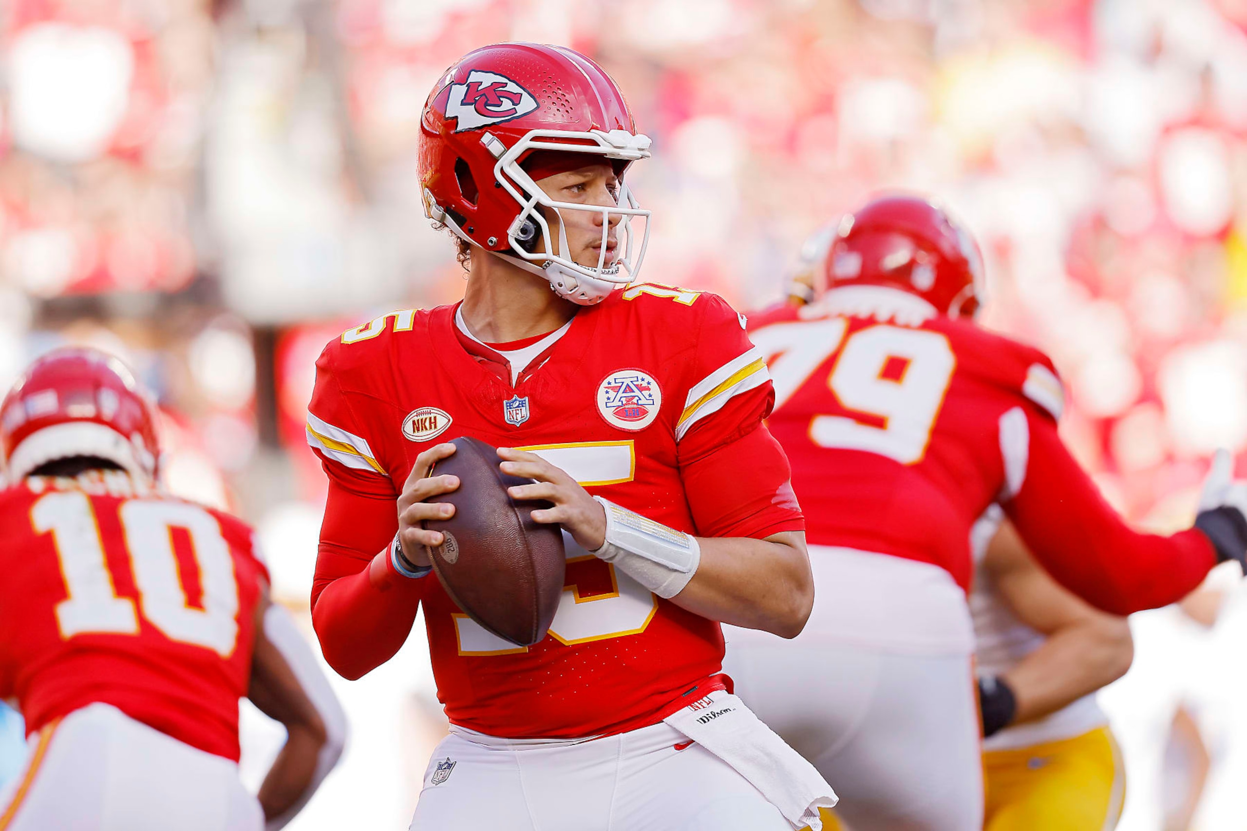 KANSAS CITY, MISSOURI - OCTOBER 22: Patrick Mahomes #15 of the Kansas City Chiefs looks to pass against the Los Angeles Chargers during the first half of the game at GEHA Field at Arrowhead Stadium on October 22, 2023 in Kansas City, Missouri. (Photo by David Eulitt/Getty Images)