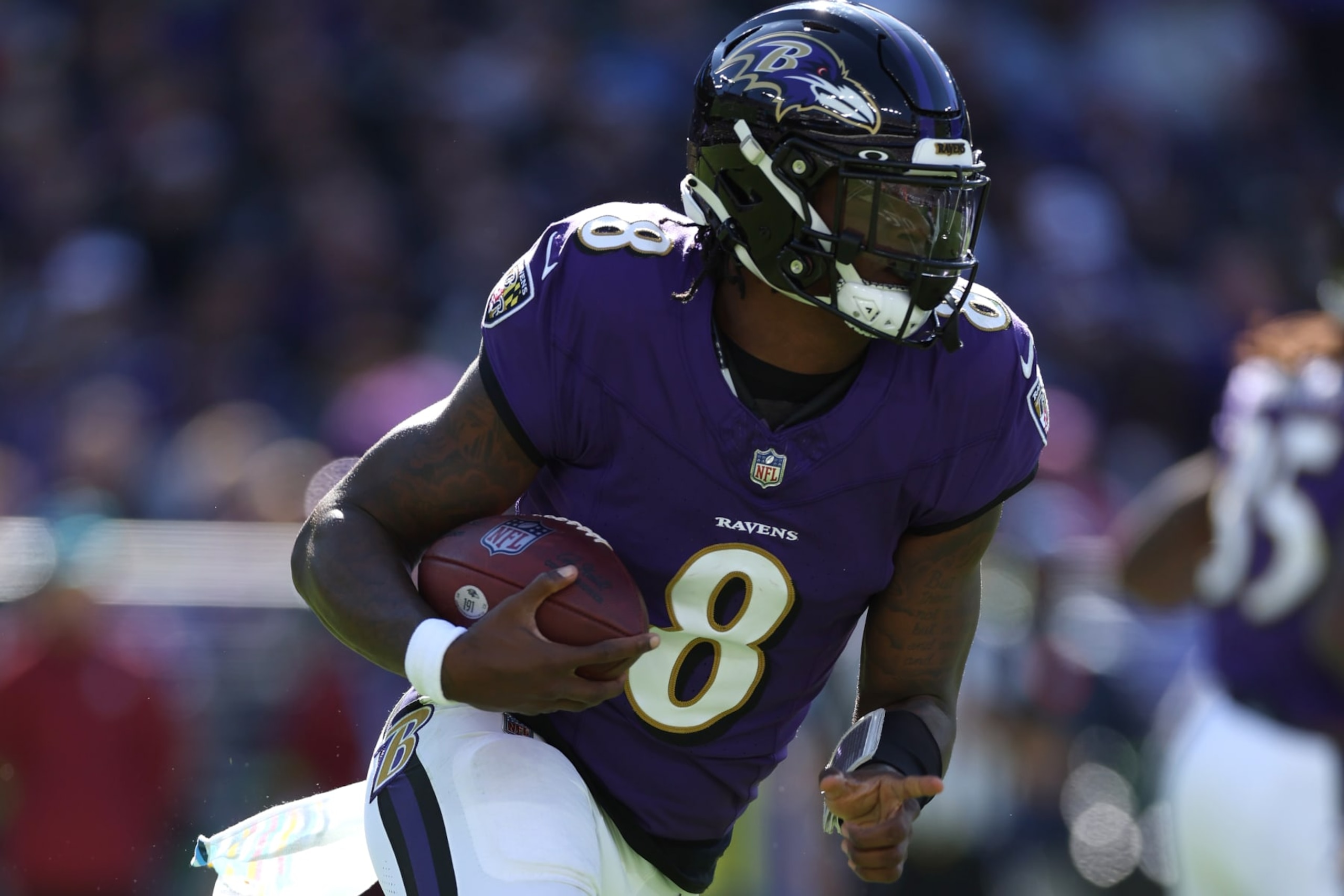 BALTIMORE, MARYLAND - OCTOBER 22: Quarterback Lamar Jackson #8 of the Baltimore Ravens rushes with the ball against the Detroit Lions at M&T Bank Stadium on October 22, 2023 in Baltimore, Maryland. (Photo by Patrick Smith/Getty Images)