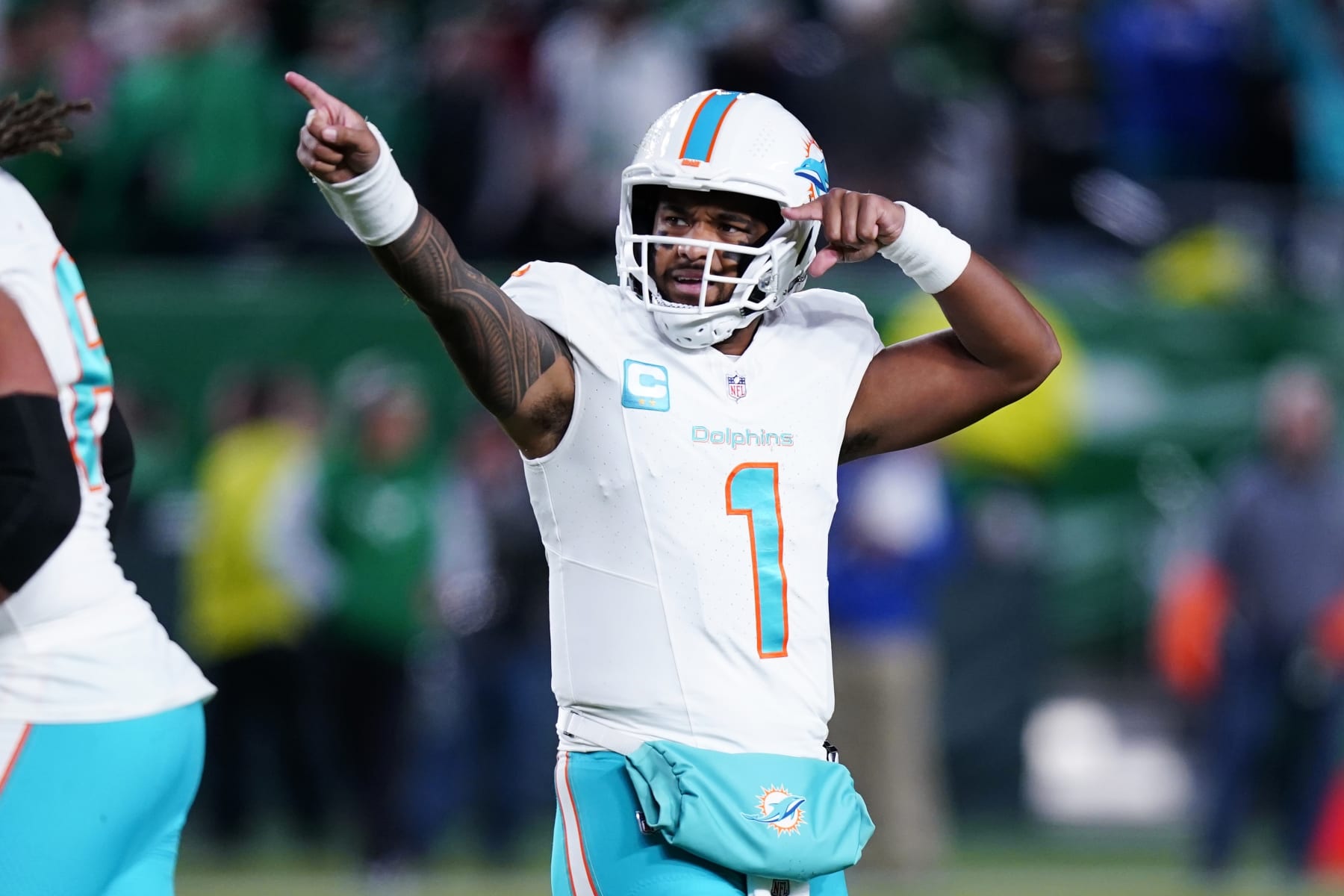 Miami Dolphins quarterback Tua Tagovailoa (1) celebrates a touchdown throw to Dolphins wide receiver Tyreek Hill during the first half of an NFL football game against the Philadelphia Eagles on Sunday, Oct. 22, 2023, in Philadelphia. (AP Photo/Chris Szagola)