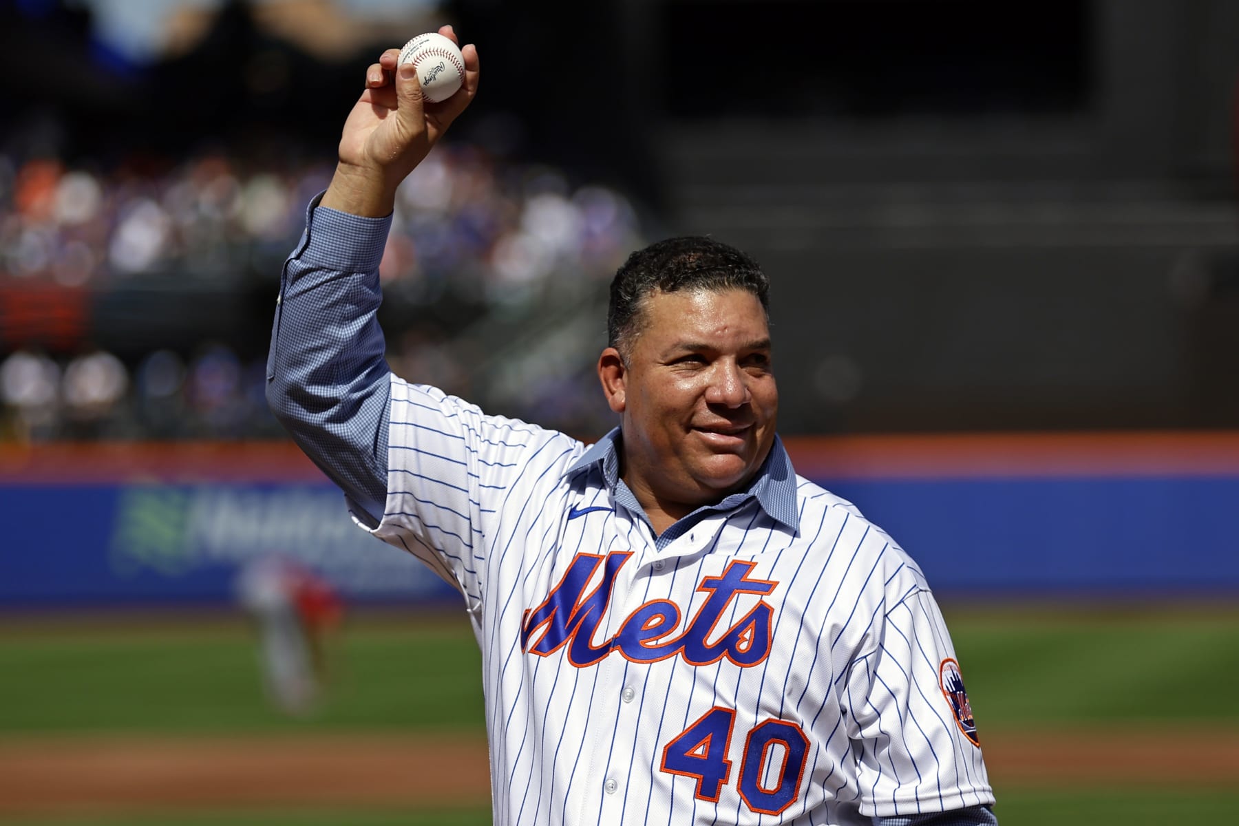 NEW YORK, NY - SEPTEMBER 17: Bartolo Colón former New York Mets reacts after throwing out the ceremonial first pitch before a game against the Cincinnati Reds at Citi Field on September 17, 2023 in New York City. (Photo by Adam Hunger/Getty Images)