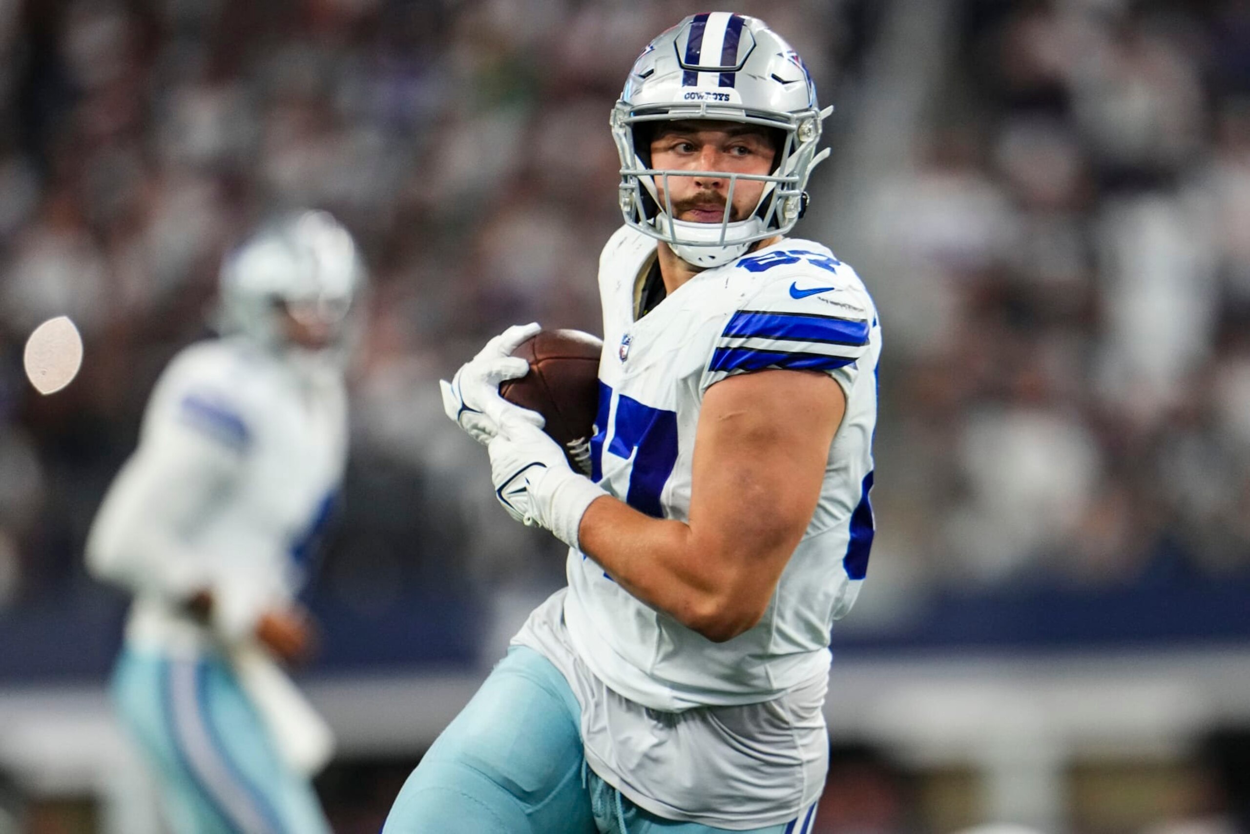 ARLINGTON, TX - SEPTEMBER 17: Jake Ferguson #87 of the Dallas Cowboys runs the ball during a football game at AT&T Stadium on September 17, 2023 in Arlington, Texas. (Photo by Cooper Neill/Getty Images) ARLINGTON, TX - SEPTEMBER 17: Jake Ferguson #87 of the Dallas Cowboys runs the ball during a football game at AT&T Stadium on September 17, 2023 in Arlington, Texas. (Photo by Cooper Neill/Getty Images)