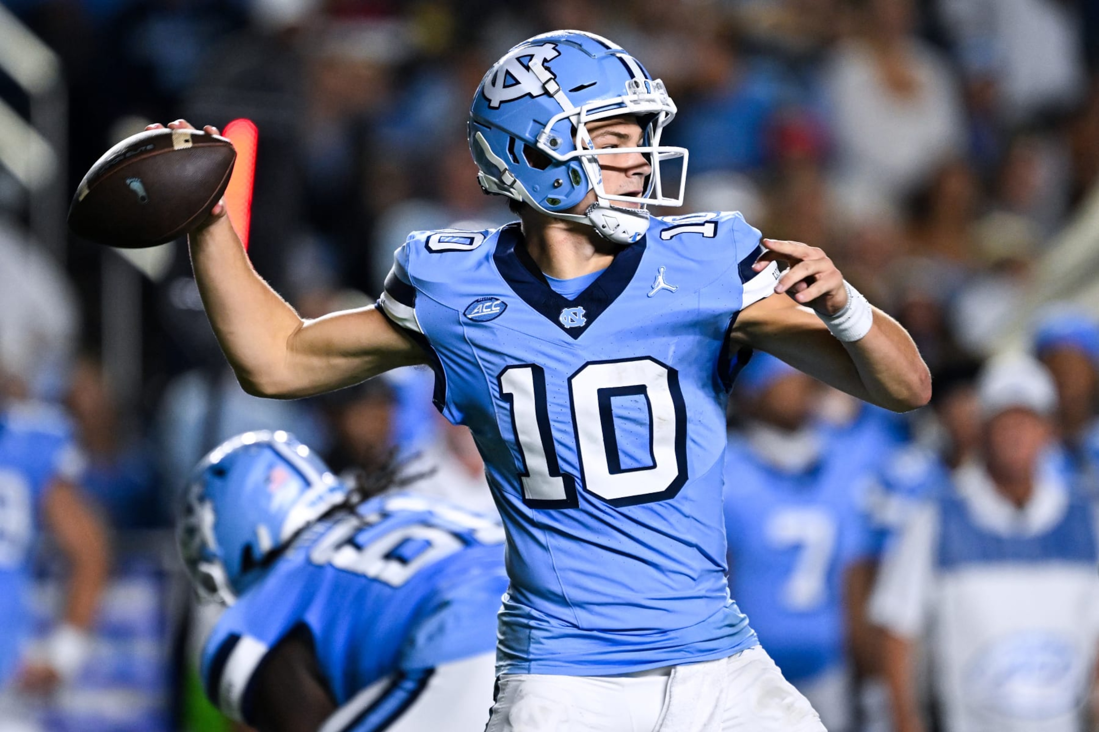 CHAPEL HILL, NORTH CAROLINA - OCTOBER 14: Drake Maye #10 of the North Carolina Tar Heels looks to pass against the Miami Hurricanes during their game at Kenan Memorial Stadium on October 14, 2023 in Chapel Hill, North Carolina. The Tar Heels won 41-31. (Photo by Grant Halverson/Getty Images) CHAPEL HILL, NORTH CAROLINA - OCTOBER 14: Drake Maye #10 of the North Carolina Tar Heels looks to pass against the Miami Hurricanes during their game at Kenan Memorial Stadium on October 14, 2023 in Chapel Hill, North Carolina. The Tar Heels won 41-31. (Photo by Grant Halverson/Getty Images)