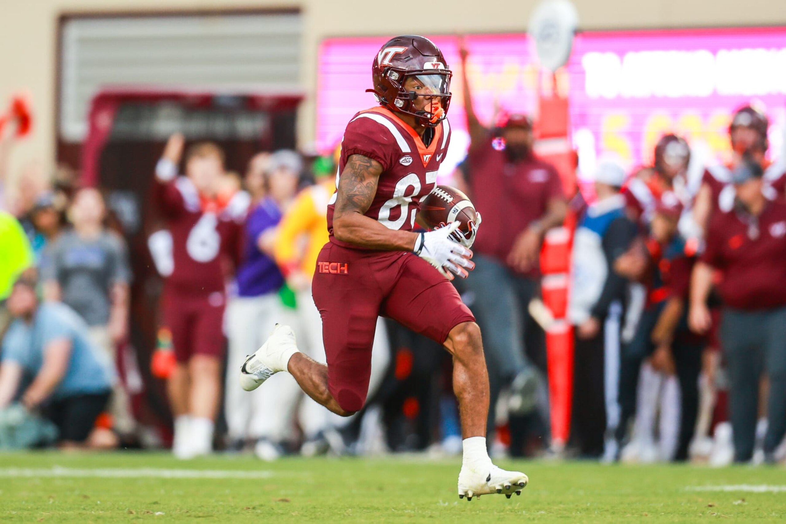 BLACKSBURG, VIRGINIA - OCTOBER 14: Jaylin Lane #83 of the Virginia Tech Hokies runs the ball for a touchdown against the Wake Forest Demon Deacons in the first half during a game at Lane Stadium on October 14, 2023 in Blacksburg, Virginia. (Photo by Ryan Hunt/Getty Images)