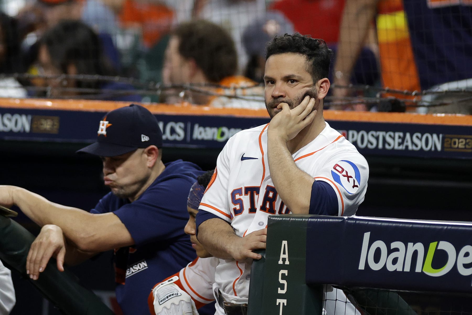HOUSTON, TEXAS - OCTOBER 23: Jose Altuve #27 of the Houston Astros looks on from the dugout against the Texas Rangers during the eighth inning in Game Seven of the American League Championship Series at Minute Maid Park on October 23, 2023 in Houston, Texas. (Photo by Carmen Mandato/Getty Images)