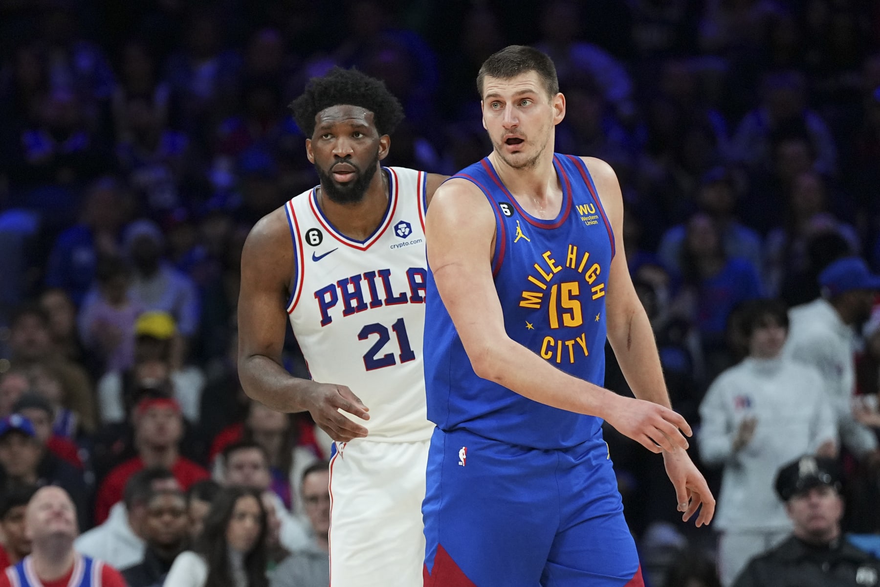 PHILADELPHIA, PA - JANUARY 28: Joel Embiid #21 of the Philadelphia 76ers guards Nikola Jokic #15 of the Denver Nuggets at the Wells Fargo Center on January 28, 2023 in Philadelphia, Pennsylvania. NOTE TO USER: User expressly acknowledges and agrees that, by downloading and or using this photograph, User is consenting to the terms and conditions of the Getty Images License Agreement. (Photo by Mitchell Leff/Getty Images)