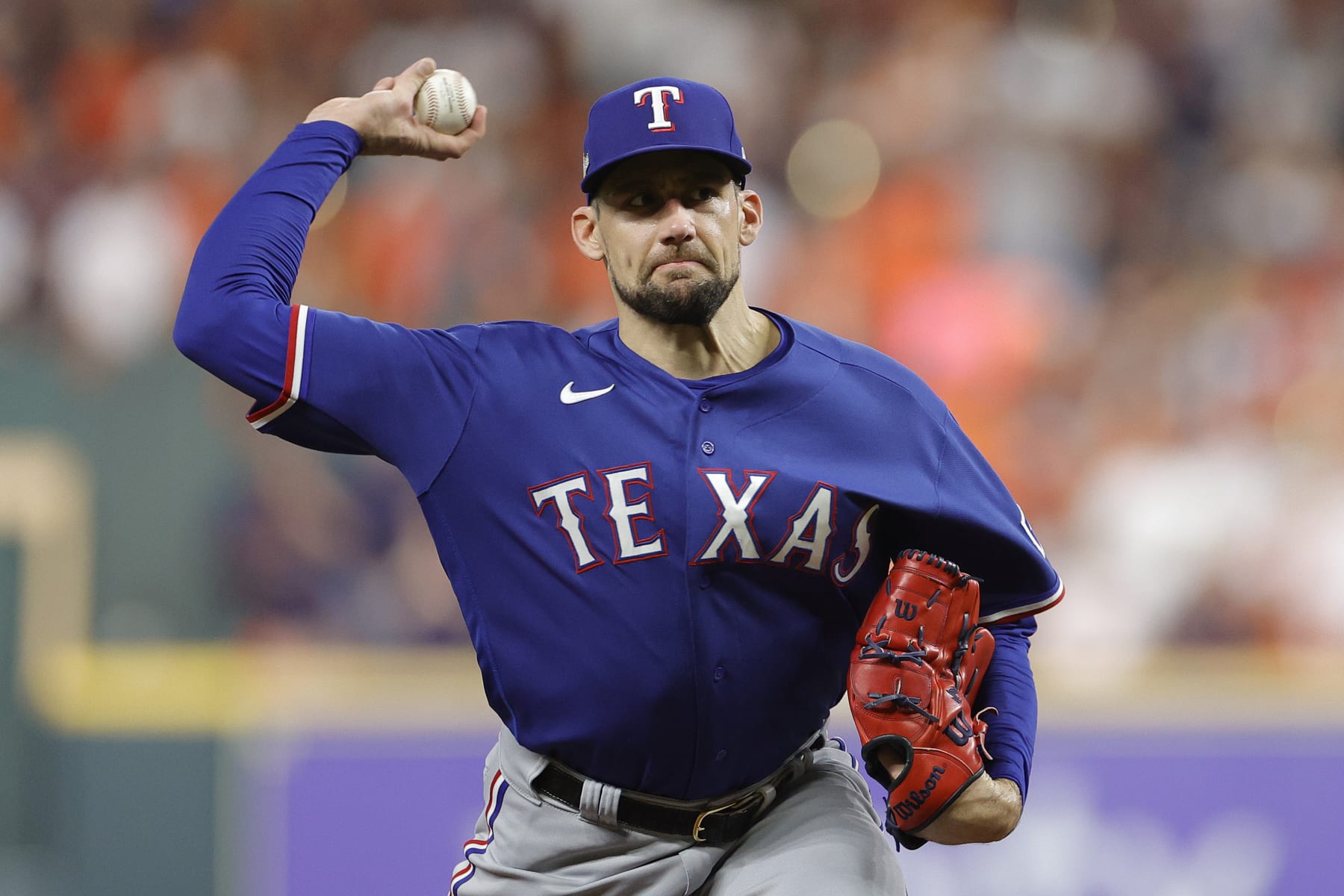 HOUSTON, TEXAS - OCTOBER 22: Nathan Eovaldi #17 of the Texas Rangers throws a pitch against the Houston Astros during the first inning in Game Six of the American League Championship Series at Minute Maid Park on October 22, 2023 in Houston, Texas. (Photo by Carmen Mandato/Getty Images)