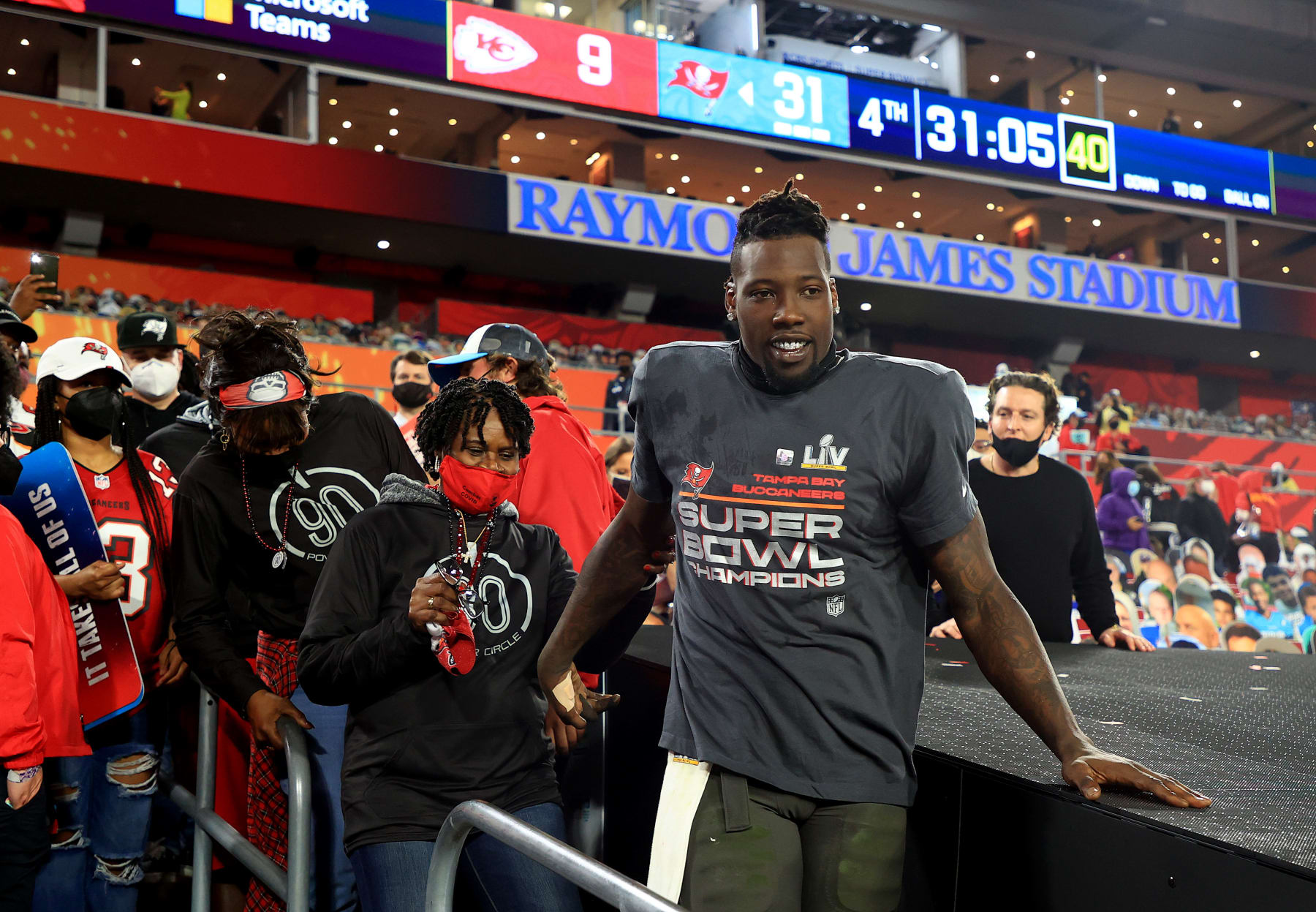 TAMPA, FLORIDA - FEBRUARY 07: Jason Pierre-Paul #90 of the Tampa Bay Buccaneers celebrates with family after winning Super Bowl LV at Raymond James Stadium on February 07, 2021 in Tampa, Florida. The Buccaneers defeated the Chiefs 31-9. (Photo by Mike Ehrmann/Getty Images)