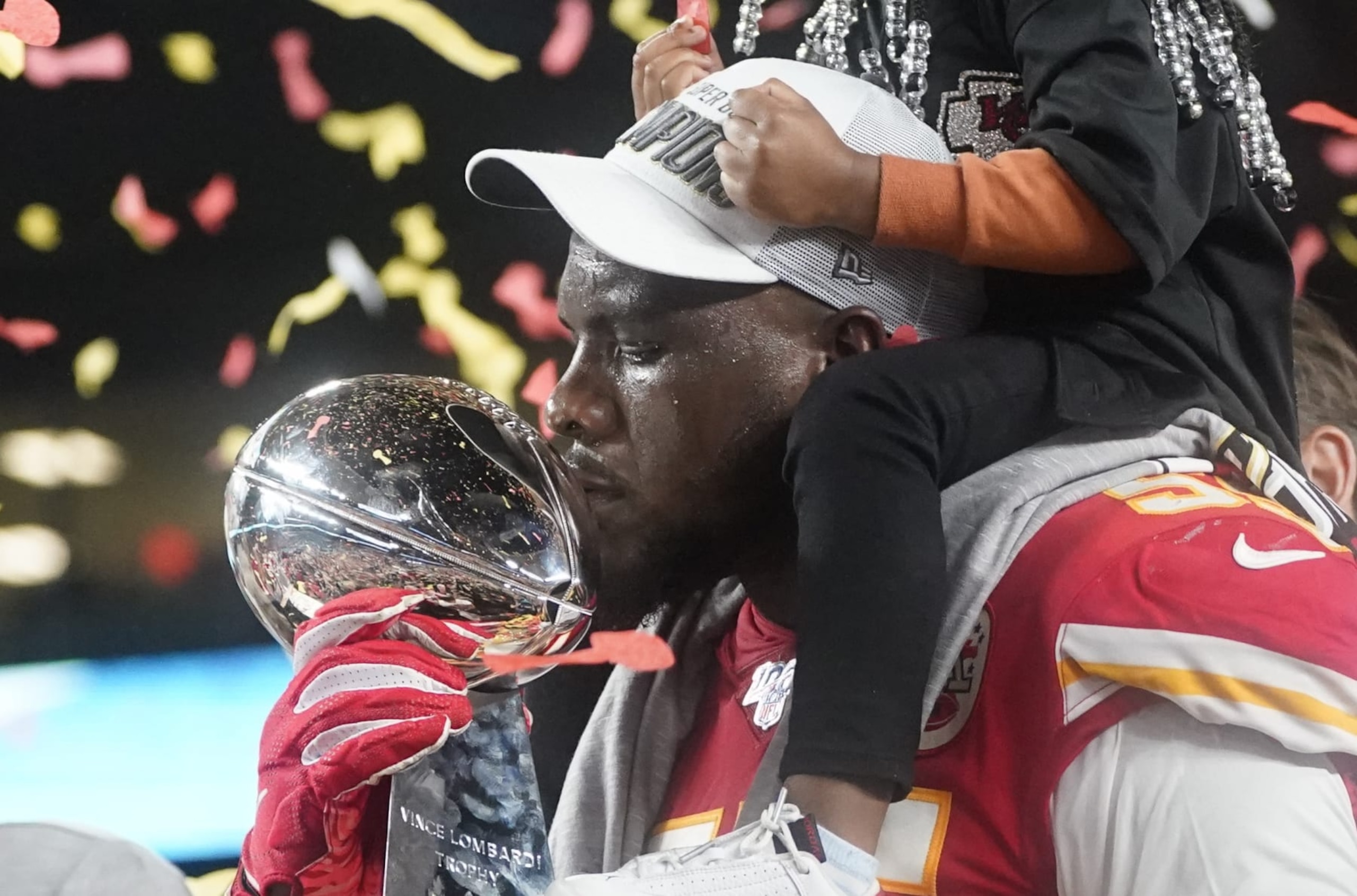 Defensive end for the Kansas City Chiefs Frank Clark kisses the Vince Lombardi Trophy on the podium after winning Super Bowl LIV against the San Francisco 49ers at Hard Rock Stadium in Miami Gardens, Florida, on February 2, 2020. (Photo by TIMOTHY A. CLARY / AFP) (Photo by TIMOTHY A. CLARY/AFP via Getty Images) Defensive end for the Kansas City Chiefs Frank Clark kisses the Vince Lombardi Trophy on the podium after winning Super Bowl LIV against the San Francisco 49ers at Hard Rock Stadium in Miami Gardens, Florida, on February 2, 2020. (Photo by TIMOTHY A. CLARY / AFP) (Photo by TIMOTHY A. CLARY/AFP via Getty Images)