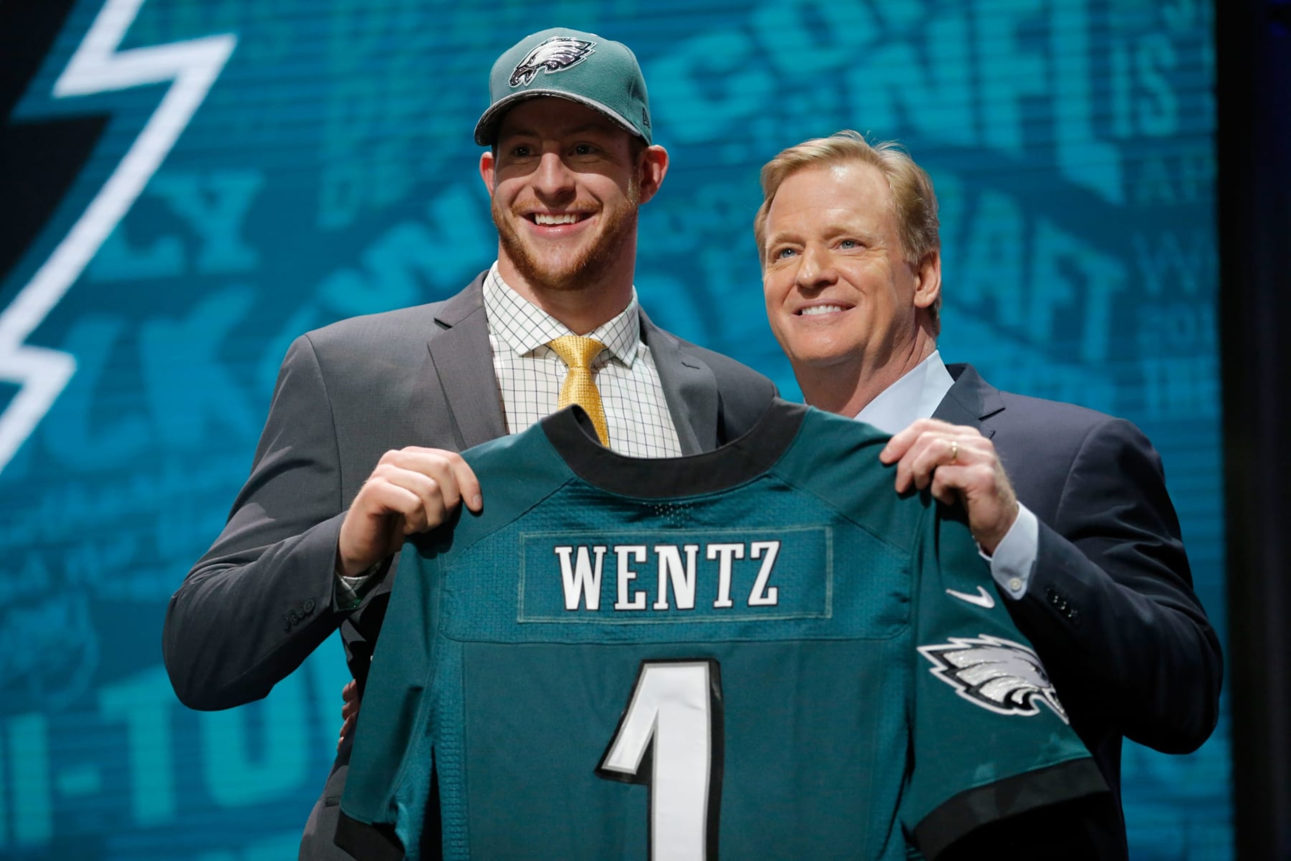 CHICAGO, IL - APRIL 28: (L-R) Carson Wentz of the North Dakota State Bison holds up a jersey with NFL Commissioner Roger Goodell after being picked #2 overall by the Philadelphia Eagles during the first round of the 2016 NFL Draft at the Auditorium Theatre of Roosevelt University on April 28, 2016 in Chicago, Illinois. (Photo by Jon Durr/Getty Images) CHICAGO, IL - APRIL 28: (L-R) Carson Wentz of the North Dakota State Bison holds up a jersey with NFL Commissioner Roger Goodell after being picked #2 overall by the Philadelphia Eagles during the first round of the 2016 NFL Draft at the Auditorium Theatre of Roosevelt University on April 28, 2016 in Chicago, Illinois. (Photo by Jon Durr/Getty Images)