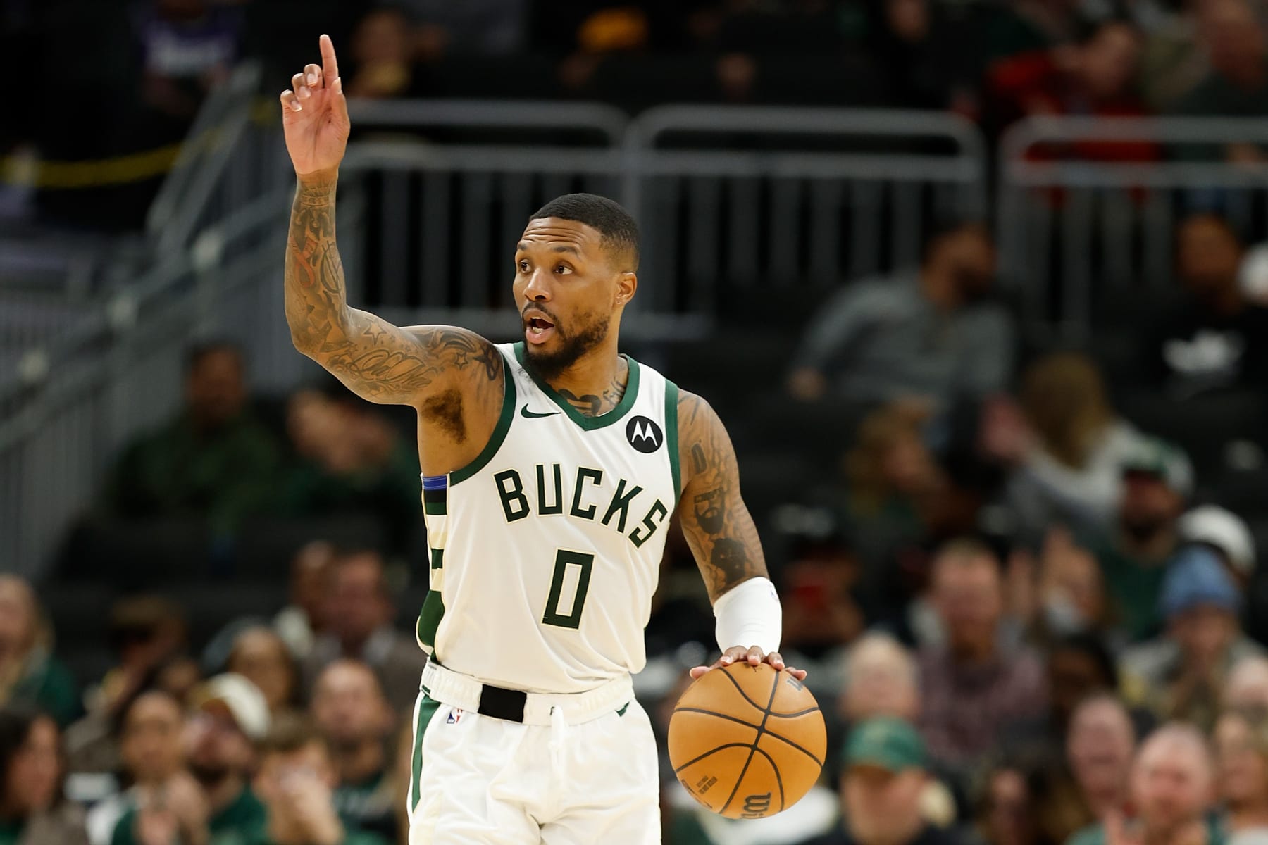 MILWAUKEE, WISCONSIN - OCTOBER 20: Damian Lillard #0 of the Milwaukee Bucks dribbles up court during the preseason game against the Memphis Grizzlies at Fiserv Forum on October 20, 2023 in Milwaukee, Wisconsin. NOTE TO USER: User expressly acknowledges and agrees that, by downloading and or using this photograph, User is consenting to the terms and conditions of the Getty Images License Agreement. (Photo by John Fisher/Getty Images)