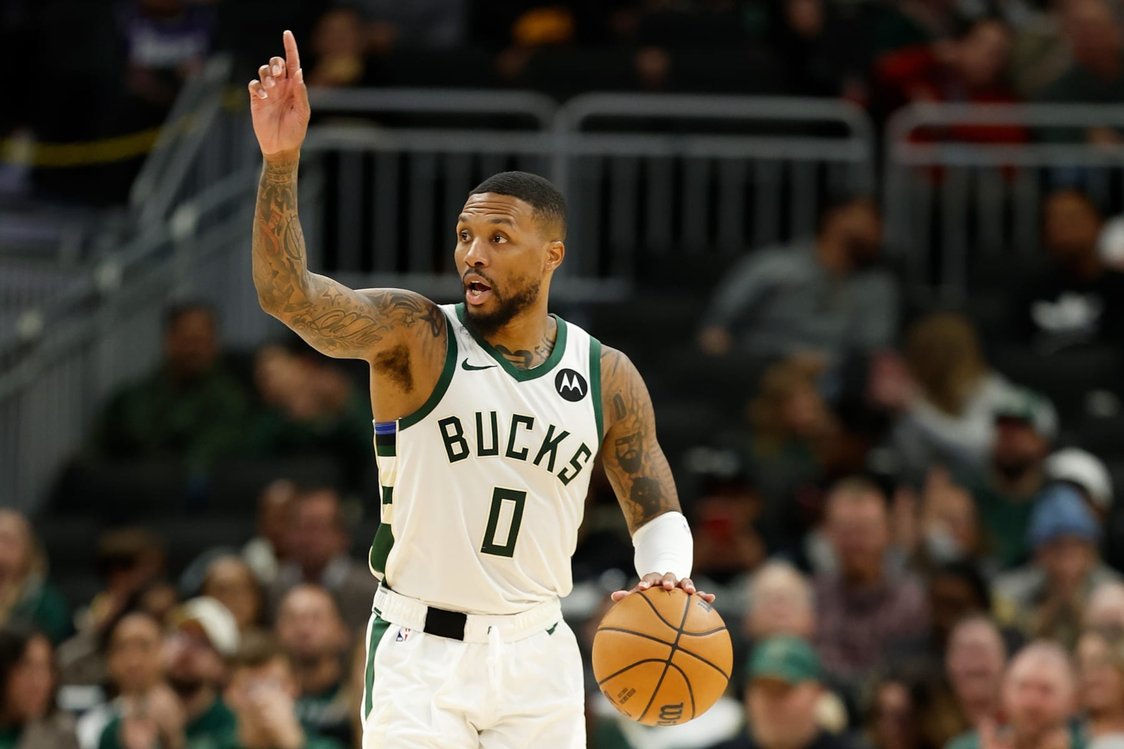 MILWAUKEE, WISCONSIN - OCTOBER 20: Damian Lillard #0 of the Milwaukee Bucks dribbles up court during the preseason game against the Memphis Grizzlies at Fiserv Forum on October 20, 2023 in Milwaukee, Wisconsin. NOTE TO USER: User expressly acknowledges and agrees that, by downloading and or using this photograph, User is consenting to the terms and conditions of the Getty Images License Agreement. (Photo by John Fisher/Getty Images) MILWAUKEE, WISCONSIN - OCTOBER 20: Damian Lillard #0 of the Milwaukee Bucks dribbles up court during the preseason game against the Memphis Grizzlies at Fiserv Forum on October 20, 2023 in Milwaukee, Wisconsin. NOTE TO USER: User expressly acknowledges and agrees that, by downloading and or using this photograph, User is consenting to the terms and conditions of the Getty Images License Agreement. (Photo by John Fisher/Getty Images)