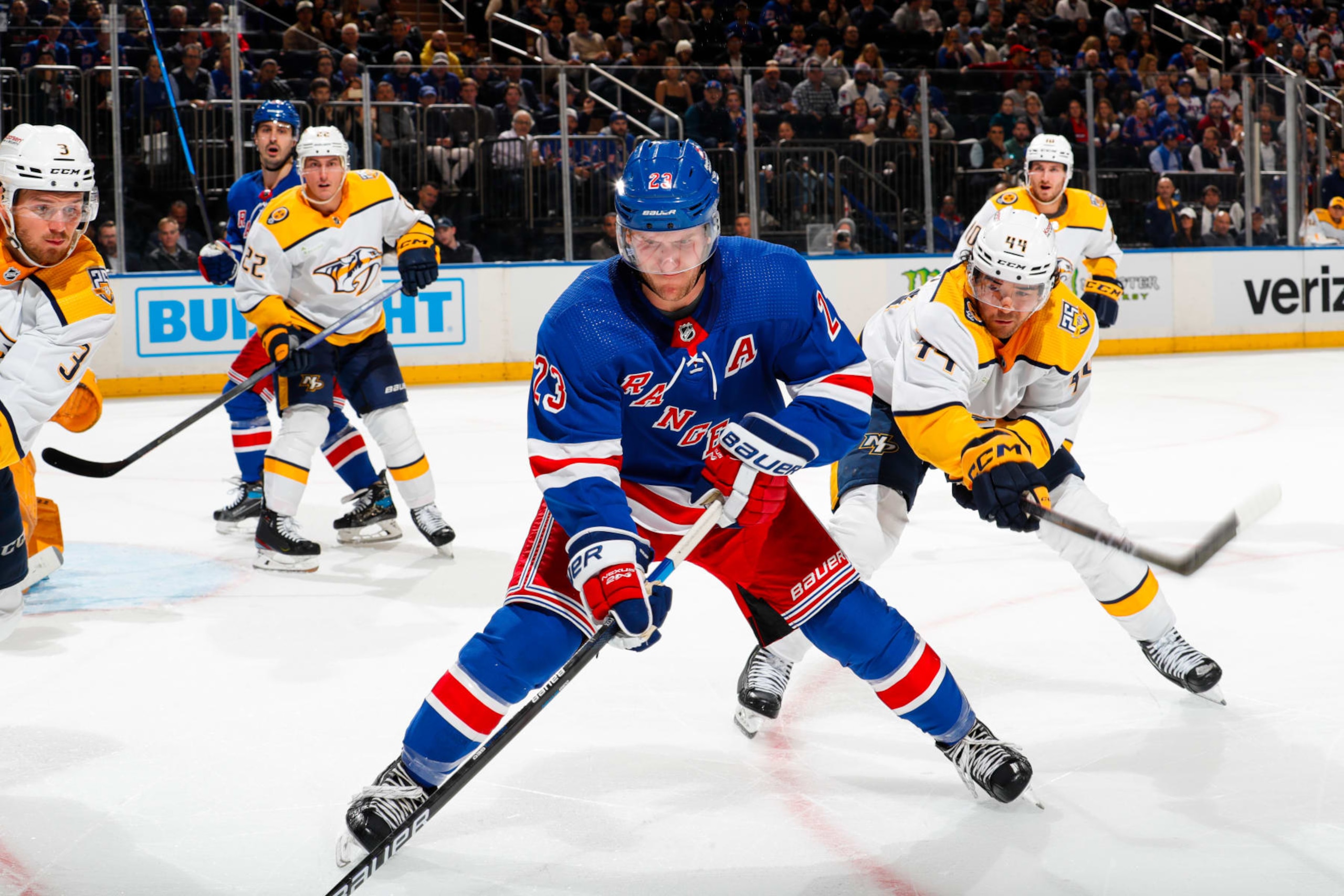 NEW YORK, NEW YORK - OCTOBER 19:  Adam Fox #23 of the New York Rangers skates with the puck against Kiefer Sherwood #44 of the Nashville Predators at Madison Square Garden on October 19, 2023 in New York City. (Photo by Jared Silber/NHLI via Getty Images)