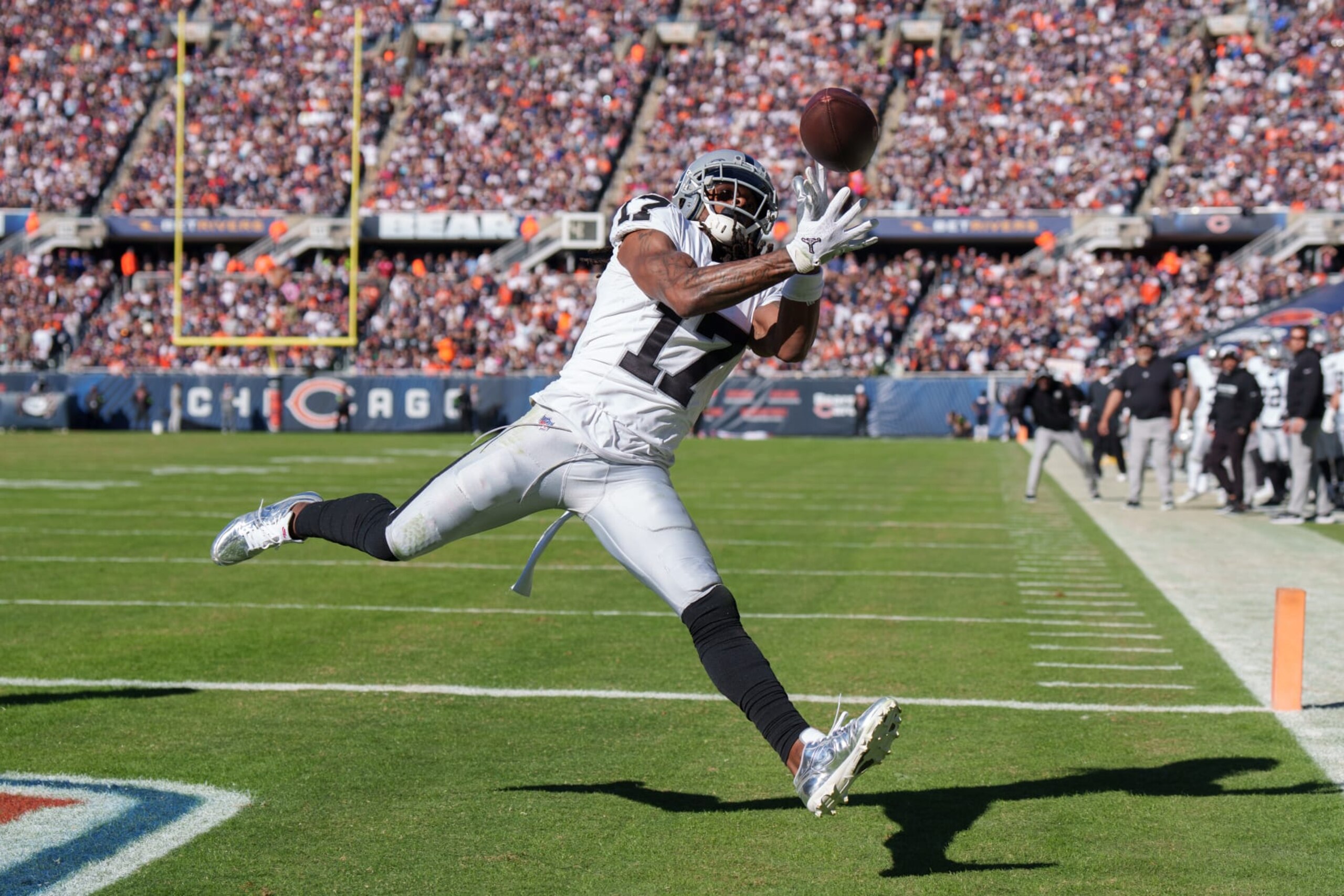 CHICAGO, IL - OCTOBER 22:  Wide receiver Davante Adams #17 of the Las Vegas Raiders attempts to catch a pass during an NFL football game against the Chicago Bears at Soldier Field on October 22, 2023 in Chicago, Illinois. (Photo by Todd Rosenberg/Getty Images)