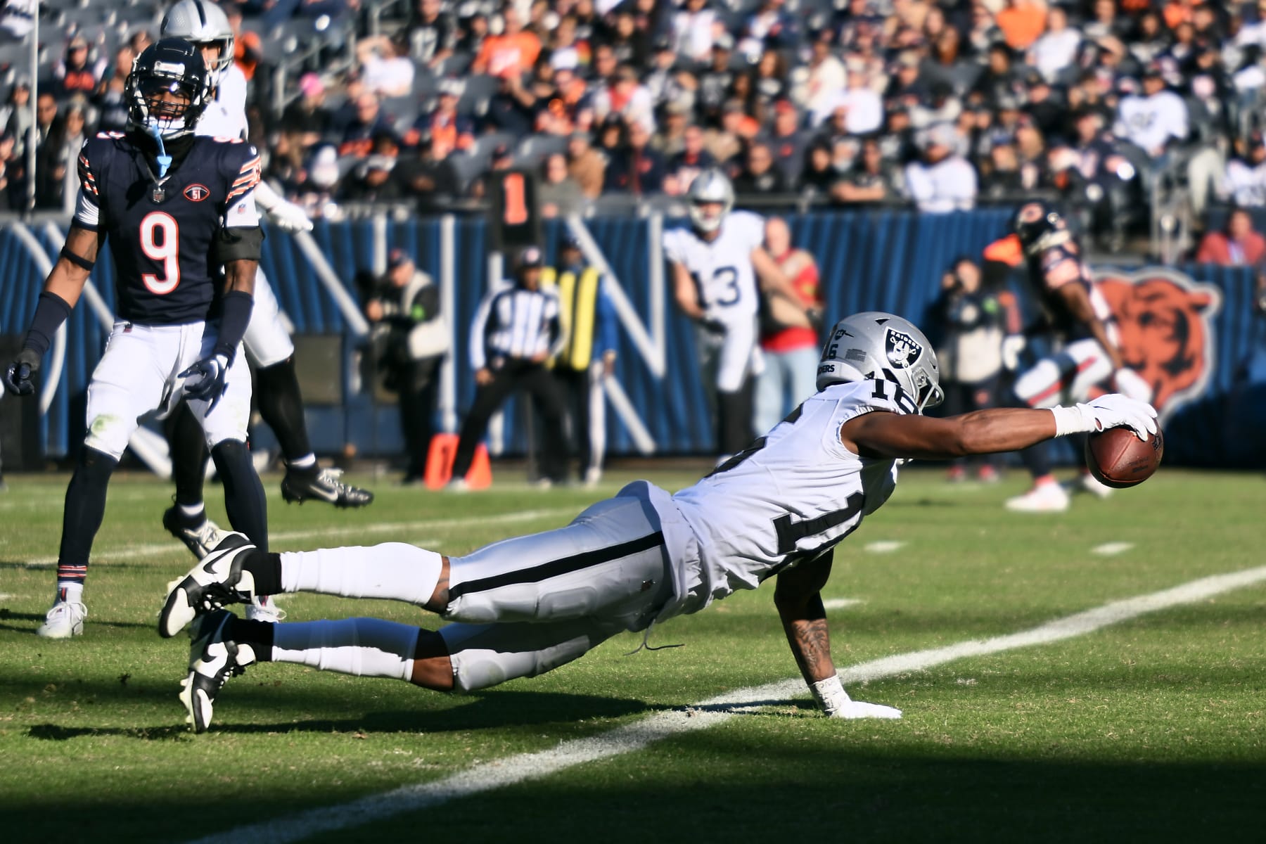 CHICAGO, ILLINOIS - OCTOBER 22: Jakobi Meyers #16 of the Las Vegas Raiders scores a touchdown during the fourth quarter against the Chicago Bears at Soldier Field on October 22, 2023 in Chicago, Illinois. (Photo by Quinn Harris/Getty Images)