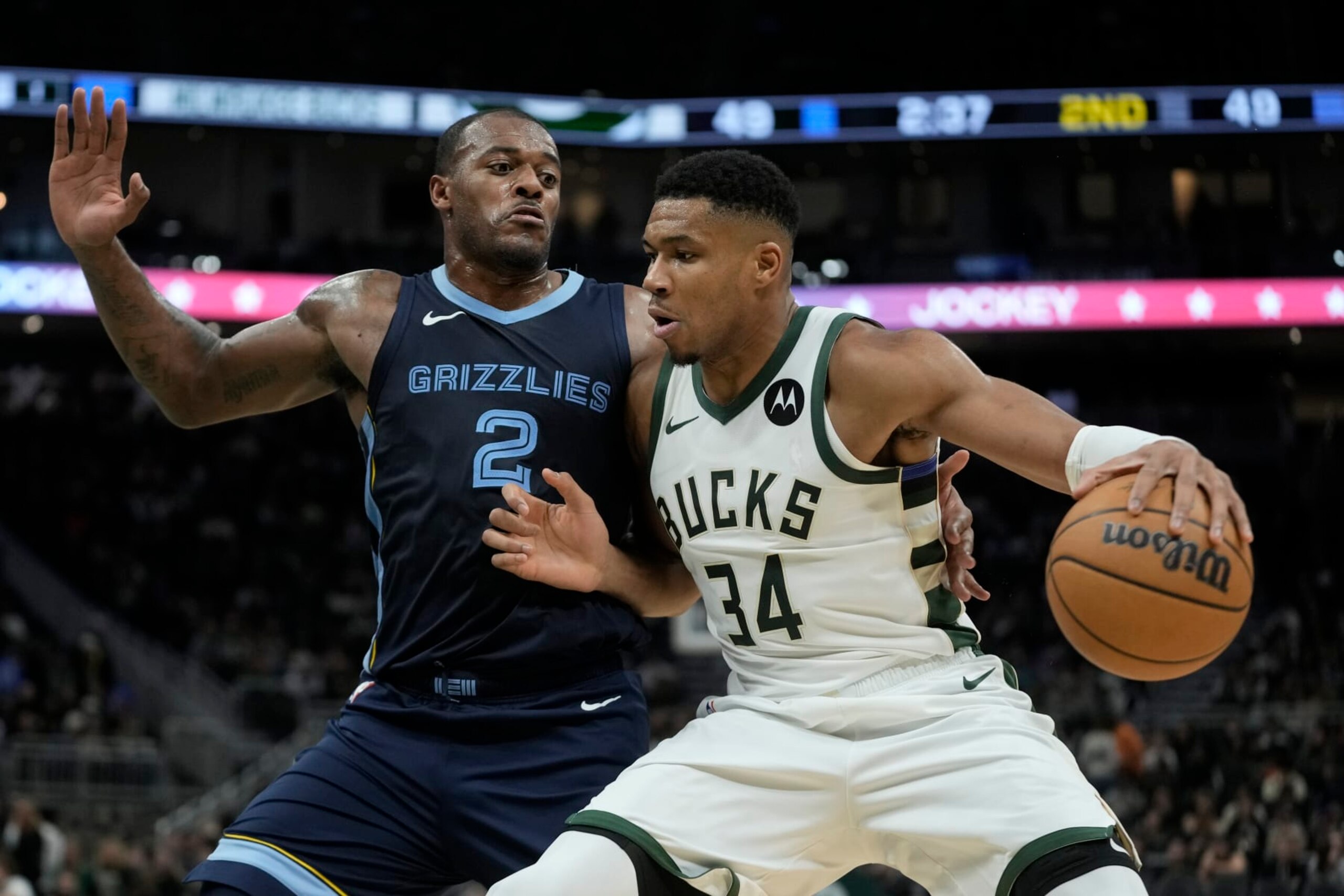Milwaukee Bucks' Giannis Antetokounmpo drives past Memphis Grizzlies' Xavier Tillman during the first half of a preseason NBA basketball game Friday, Oct. 20, 2023, in Milwaukee. (AP Photo/Morry Gash)