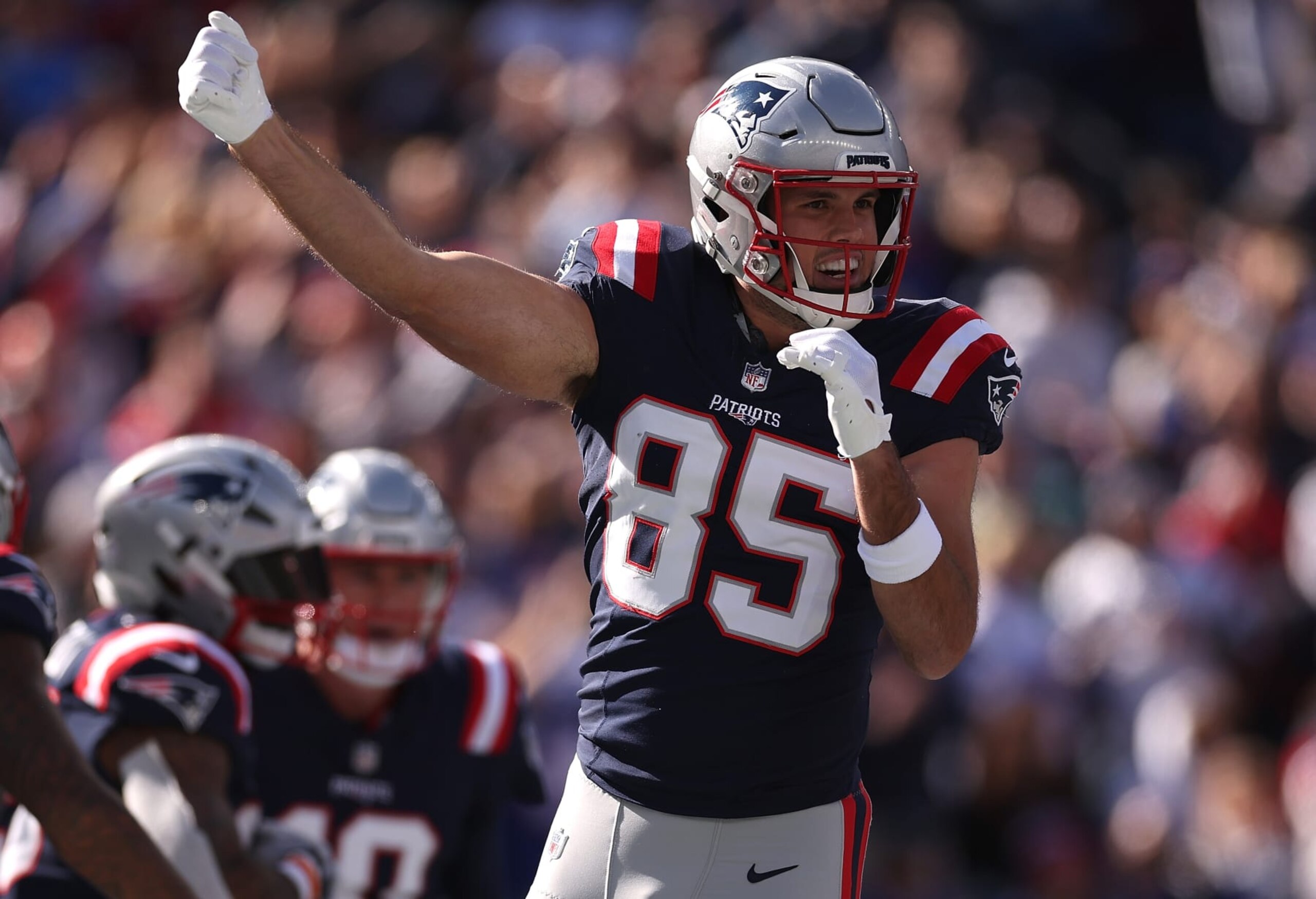 FOXBOROUGH, MASSACHUSETTS - OCTOBER 22: Hunter Henry #85 of the New England Patriots celebrates after a touchdown score by Ezekiel Elliot #15 in the first quarter of the game against the Buffalo Bills at Gillette Stadium on October 22, 2023 in Foxborough, Massachusetts. (Photo by Maddie Meyer/Getty Images)