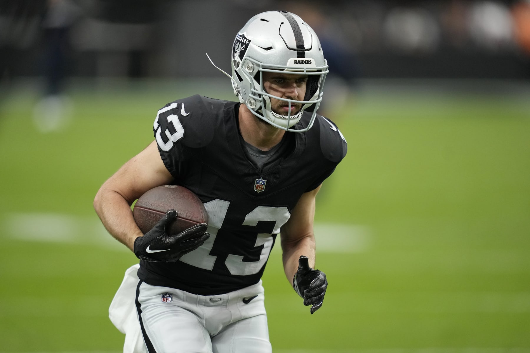 Las Vegas Raiders wide receiver Hunter Renfrow (13) warms up before an NFL football game against the New England Patriots, Sunday, Oct. 15, 2023, in Las Vegas. (AP Photo/John Locher)