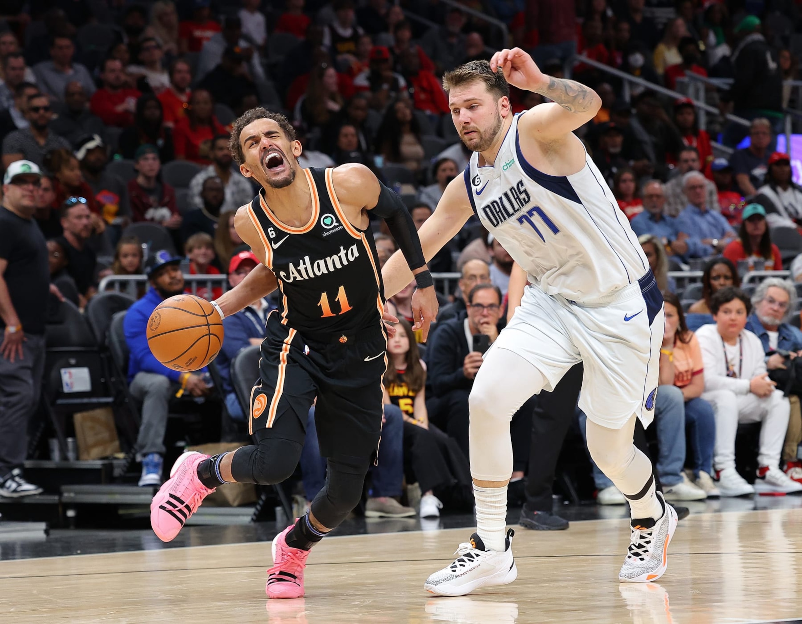 ATLANTA, GEORGIA - APRIL 02: Trae Young #11 of the Atlanta Hawks drives against Luka Doncic #77 of the Dallas Mavericks during overtime at State Farm Arena on April 02, 2023 in Atlanta, Georgia. NOTE TO USER: User expressly acknowledges and agrees that, by downloading and or using this photograph, User is consenting to the terms and conditions of the Getty Images License Agreement. (Photo by Kevin C. Cox/Getty Images) ATLANTA, GEORGIA - APRIL 02: Trae Young #11 of the Atlanta Hawks drives against Luka Doncic #77 of the Dallas Mavericks during overtime at State Farm Arena on April 02, 2023 in Atlanta, Georgia. NOTE TO USER: User expressly acknowledges and agrees that, by downloading and or using this photograph, User is consenting to the terms and conditions of the Getty Images License Agreement. (Photo by Kevin C. Cox/Getty Images)