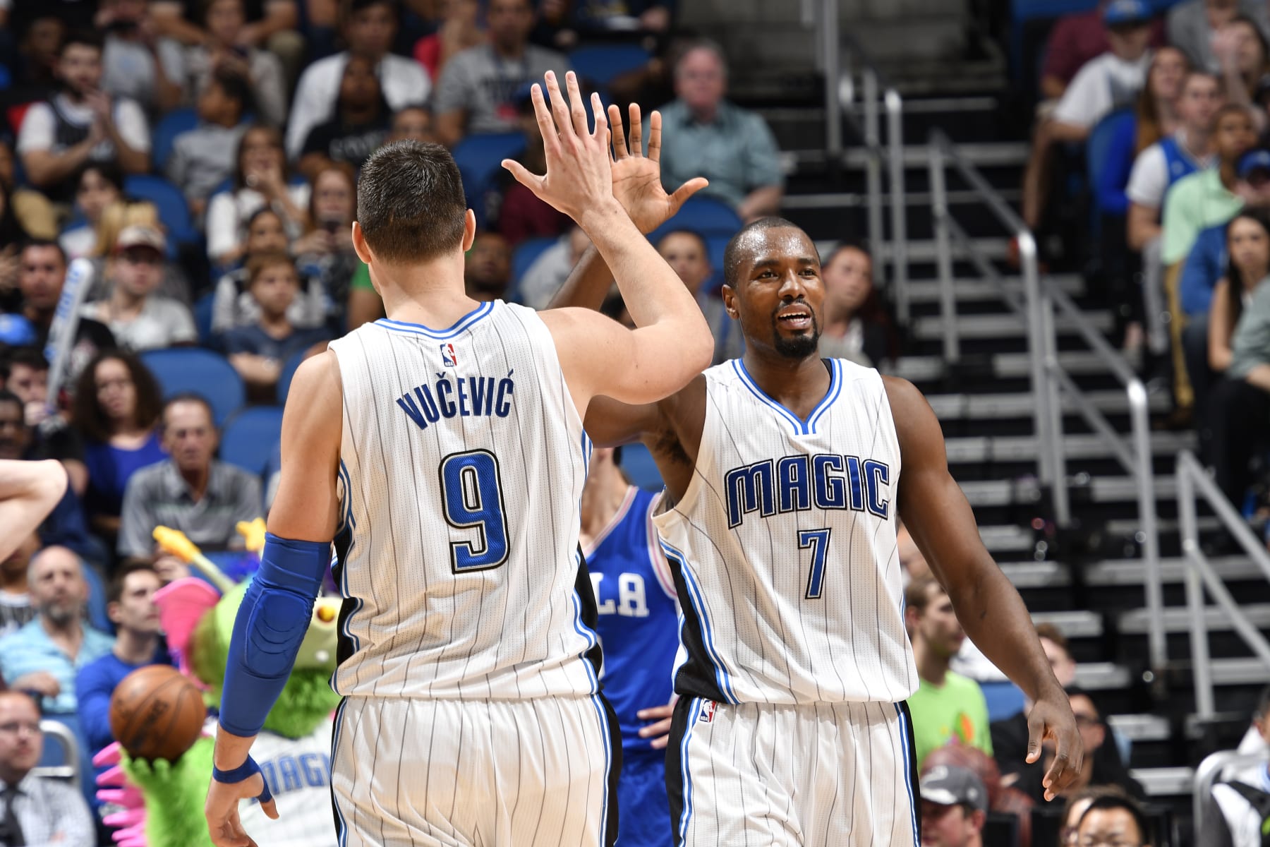ORLANDO, FL - FEBRUARY 9:  Serge Ibaka #7 and Nikola Vucevic #9 of the Orlando Magic high-five during a game against the Philadelphia 76ers on February 9, 2017 at Amway Center in Orlando, Florida. NOTE TO USER: User expressly acknowledges and agrees that, by downloading and/or using this photograph, user is consenting to the terms and conditions of the Getty Images License Agreement. Mandatory Copyright Notice: Copyright 2017 NBAE (Photo by Fernando Medina/NBAE via Getty Images)