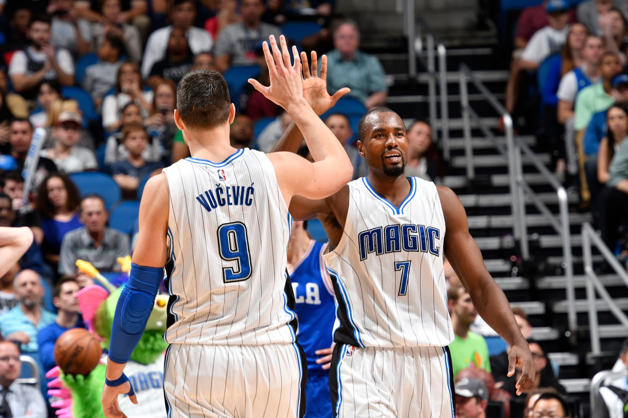 ORLANDO, FL - FEBRUARY 9: Serge Ibaka #7 and Nikola Vucevic #9 of the Orlando Magic high-five during a game against the Philadelphia 76ers on February 9, 2017 at Amway Center in Orlando, Florida. NOTE TO USER: User expressly acknowledges and agrees that, by downloading and/or using this photograph, user is consenting to the terms and conditions of the Getty Images License Agreement. Mandatory Copyright Notice: Copyright 2017 NBAE (Photo by Fernando Medina/NBAE via Getty Images) ORLANDO, FL - FEBRUARY 9: Serge Ibaka #7 and Nikola Vucevic #9 of the Orlando Magic high-five during a game against the Philadelphia 76ers on February 9, 2017 at Amway Center in Orlando, Florida. NOTE TO USER: User expressly acknowledges and agrees that, by downloading and/or using this photograph, user is consenting to the terms and conditions of the Getty Images License Agreement. Mandatory Copyright Notice: Copyright 2017 NBAE (Photo by Fernando Medina/NBAE via Getty Images)