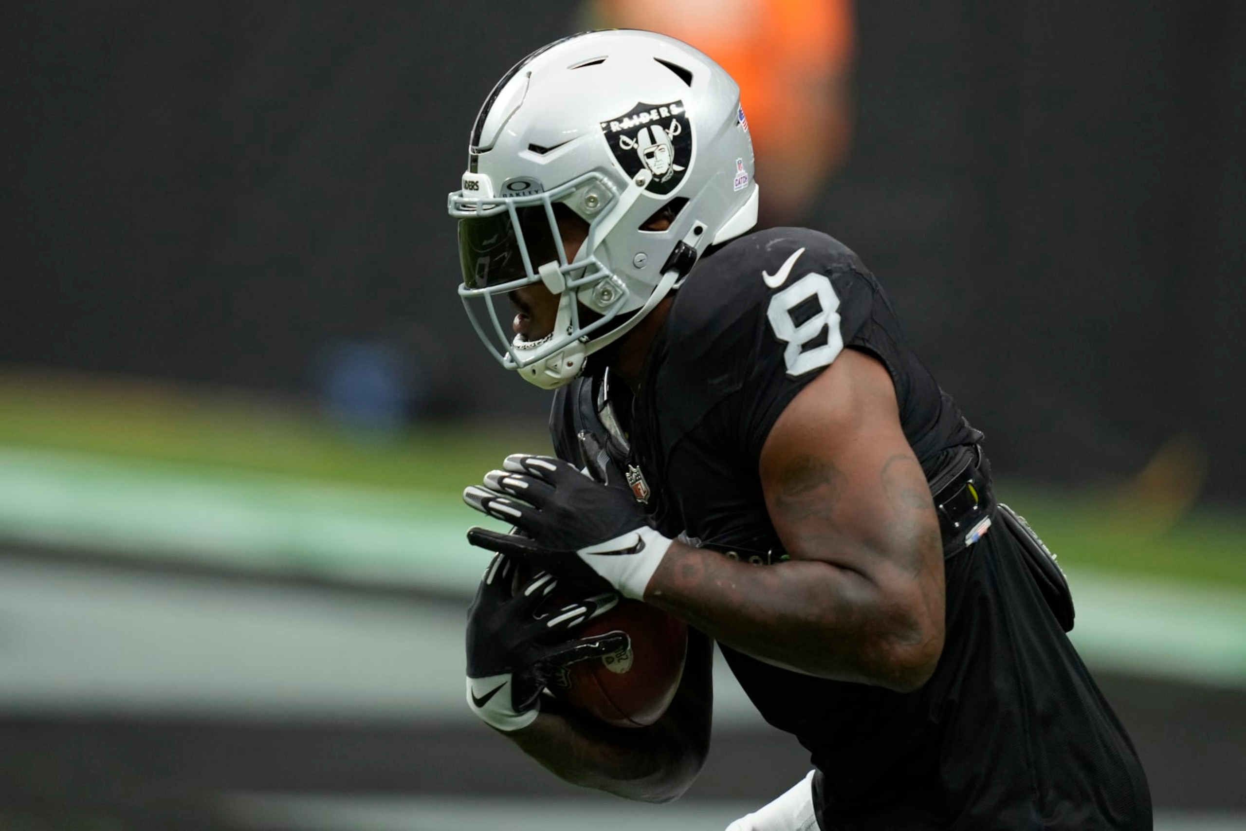 Las Vegas Raiders running back Josh Jacobs (8) warms up before an NFL football game against the New England Patriots, Sunday, Oct. 15, 2023, in Las Vegas. (AP Photo/John Locher) Las Vegas Raiders running back Josh Jacobs (8) warms up before an NFL football game against the New England Patriots, Sunday, Oct. 15, 2023, in Las Vegas. (AP Photo/John Locher)