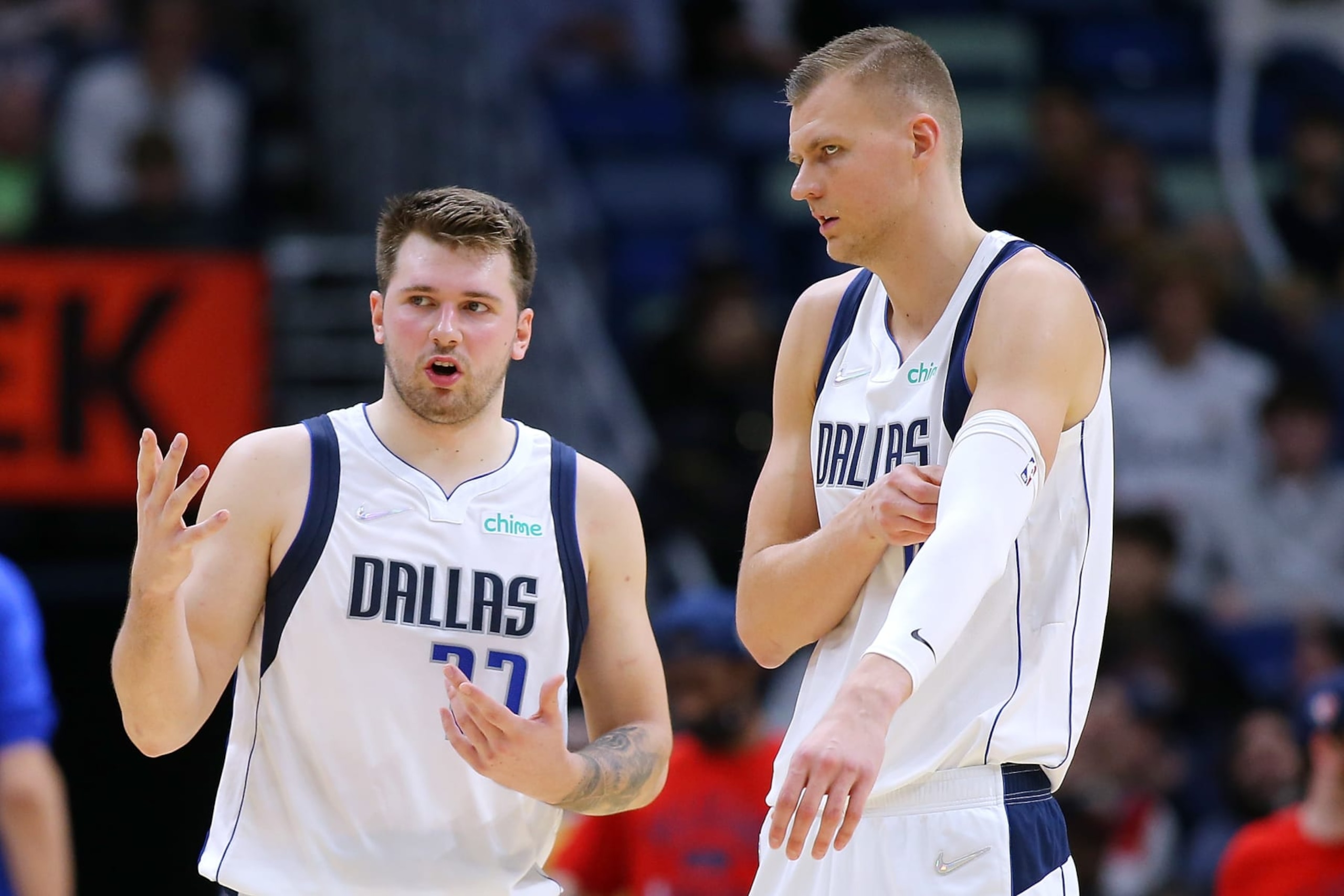 NEW ORLEANS, LOUISIANA - DECEMBER 01: Luka Doncic #77 and Kristaps Porzingis #6 of the Dallas Mavericks talk during the second half against the New Orleans Pelicans at Smoothie King Center on December 01, 2021 in New Orleans, Louisiana. NOTE TO USER: User expressly acknowledges and agrees that, by downloading and or using this Photograph, user is consenting to the terms and conditions of the Getty Images License Agreement. (Photo by Jonathan Bachman/Getty Images) NEW ORLEANS, LOUISIANA - DECEMBER 01: Luka Doncic #77 and Kristaps Porzingis #6 of the Dallas Mavericks talk during the second half against the New Orleans Pelicans at Smoothie King Center on December 01, 2021 in New Orleans, Louisiana. NOTE TO USER: User expressly acknowledges and agrees that, by downloading and or using this Photograph, user is consenting to the terms and conditions of the Getty Images License Agreement. (Photo by Jonathan Bachman/Getty Images)