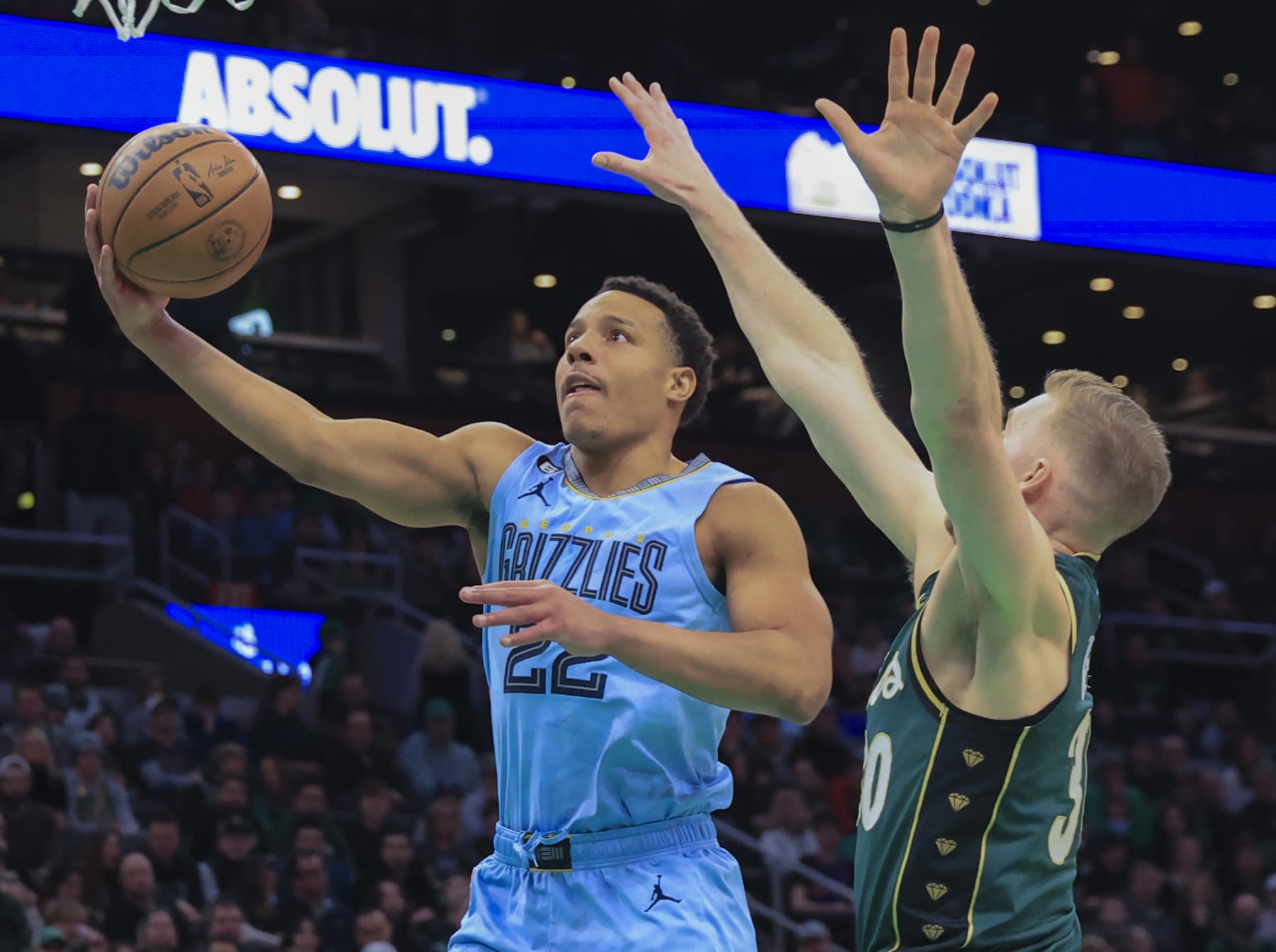 Boston, MA - February 12: Memphis Grizzlies SG Desmond Bane goes in for a lay-up against Boston Celtics SF Sam Hauser in the first quarter. The Celtics beat the Grizzlies, 119-109. (Photo by Matthew J. Lee/The Boston Globe via Getty Images)