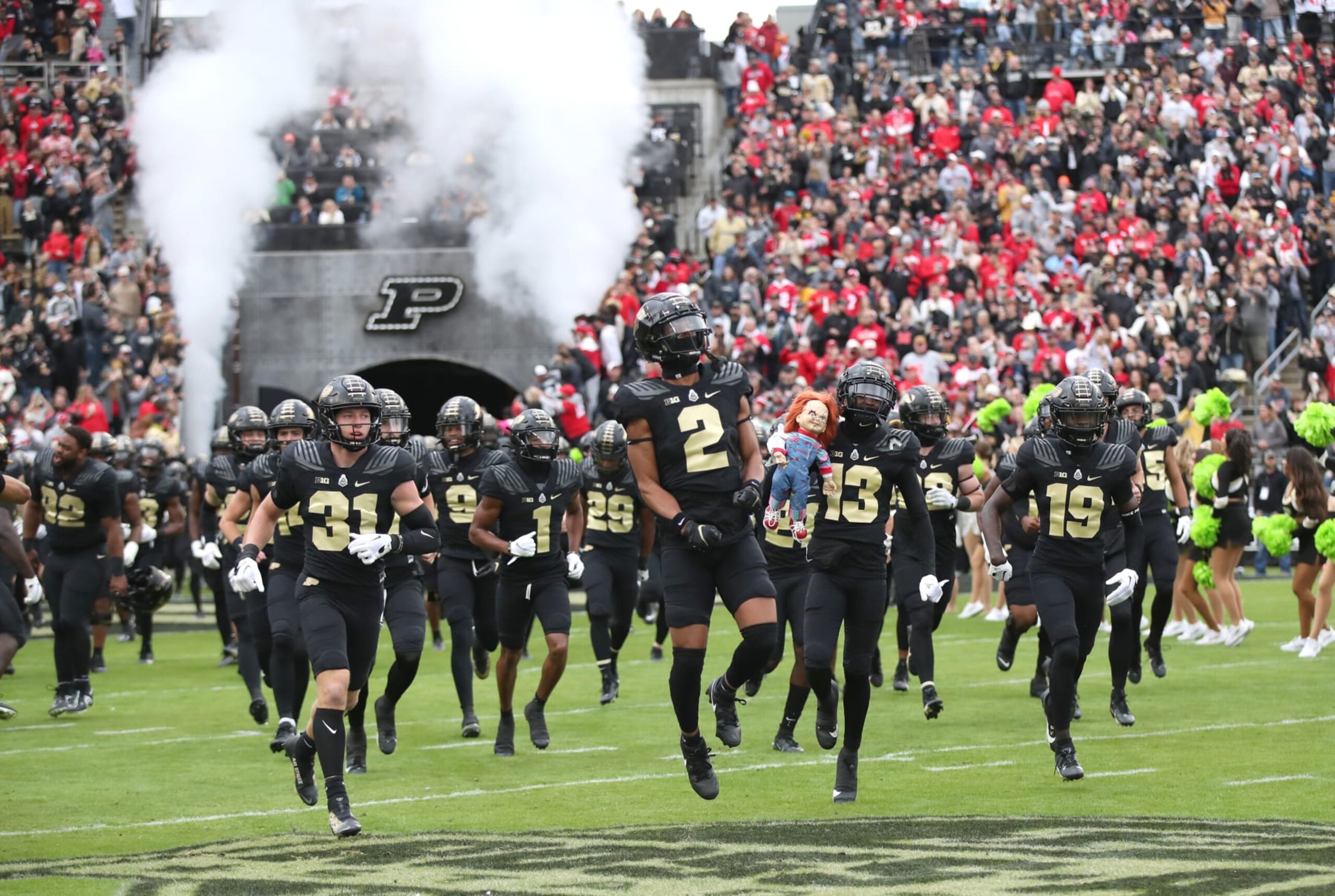 WEST LAFAYETTE, INDIANA - OCTOBER 14: The Purdue football team runs out of the Tiller Tunnel onto the field before the Purdue University Boilermakers versus the Ohio State Buckeyes football game at Ross-Ade Stadium on October 14, 2023 in West Lafayette, Indiana. (Photo by Bruce Yeung/Getty Images)