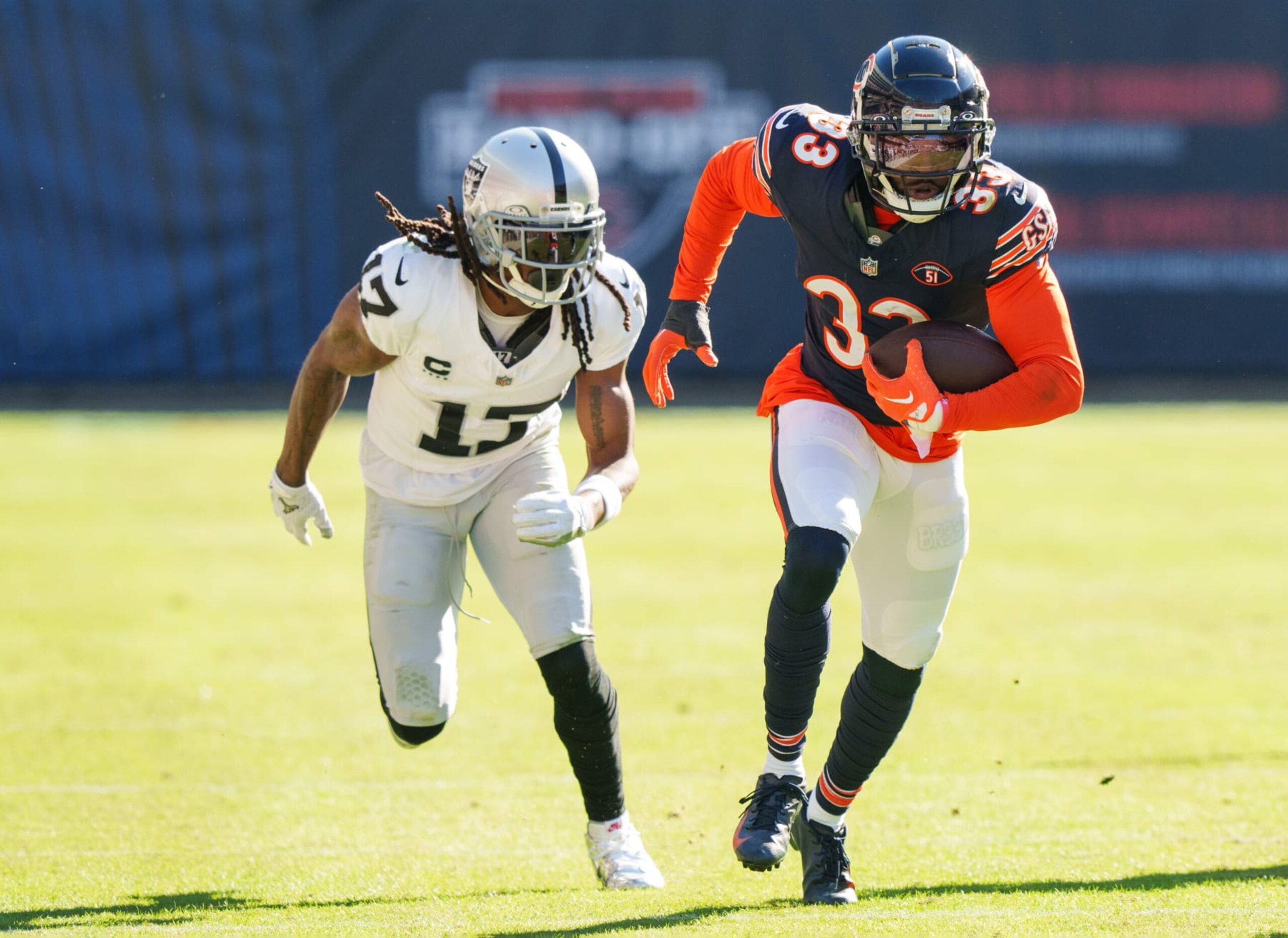 CHICAGO, IL - OCTOBER 22:  Cornerback Jaylon Johnson #33 of the Chicago Bears heads for the end zone after intercepting a pass intended for Wide receiver Davante Adams #17 of the Las Vegas Raiders during an NFL football at Soldier Field on October 22, 2023 in Chicago, Illinois. (Photo by Todd Rosenberg/Getty Images)