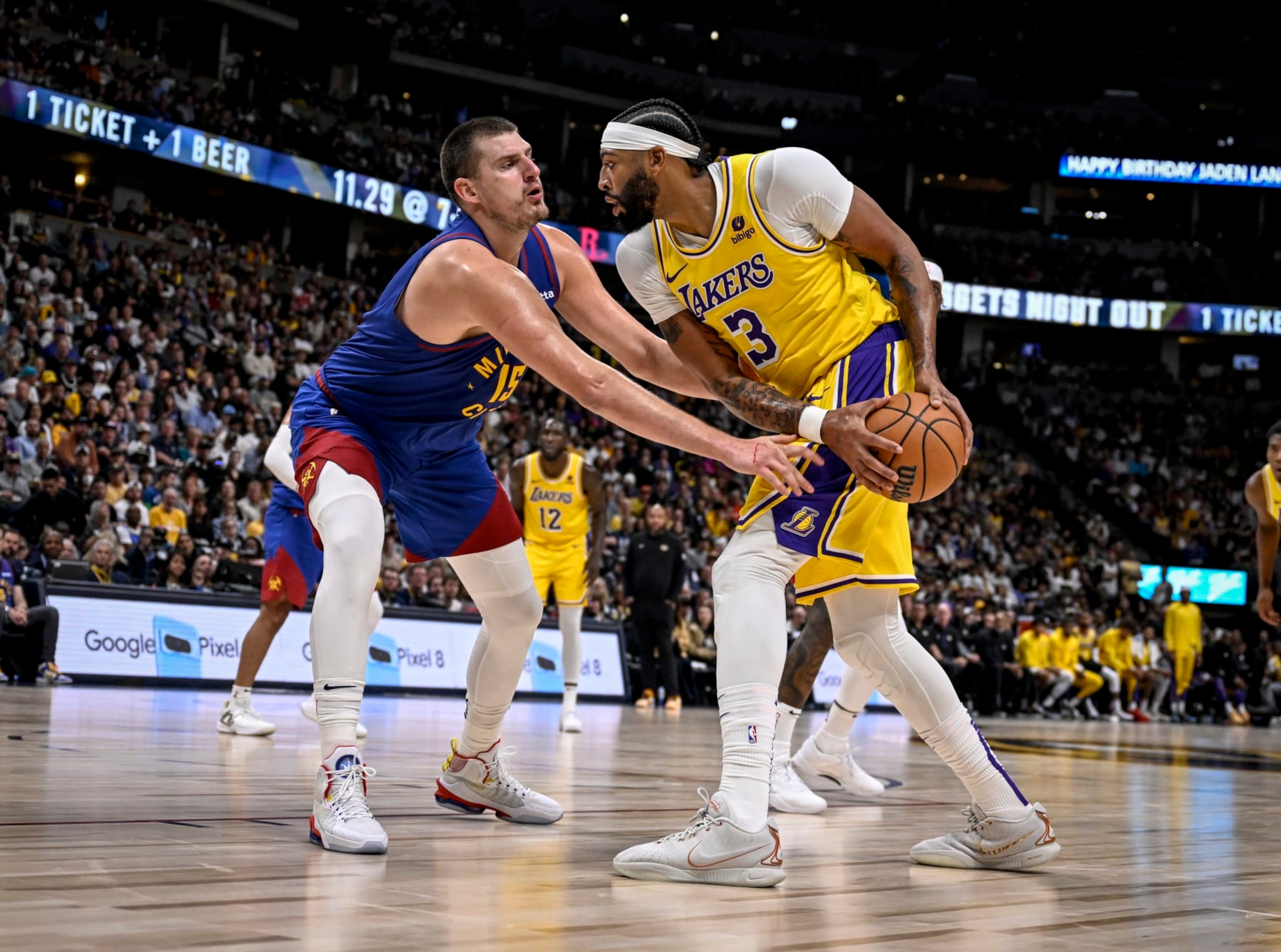 DENVER, CO - OCTOBER 24: Nikola Jokic (15) of the Denver Nuggets locks up Anthony Davis (3) of the Los Angeles Lakers during the third quarter at Ball Arena in Denver on Tuesday, October 24, 2023. (Photo by AAron Ontiveroz/The Denver Post)