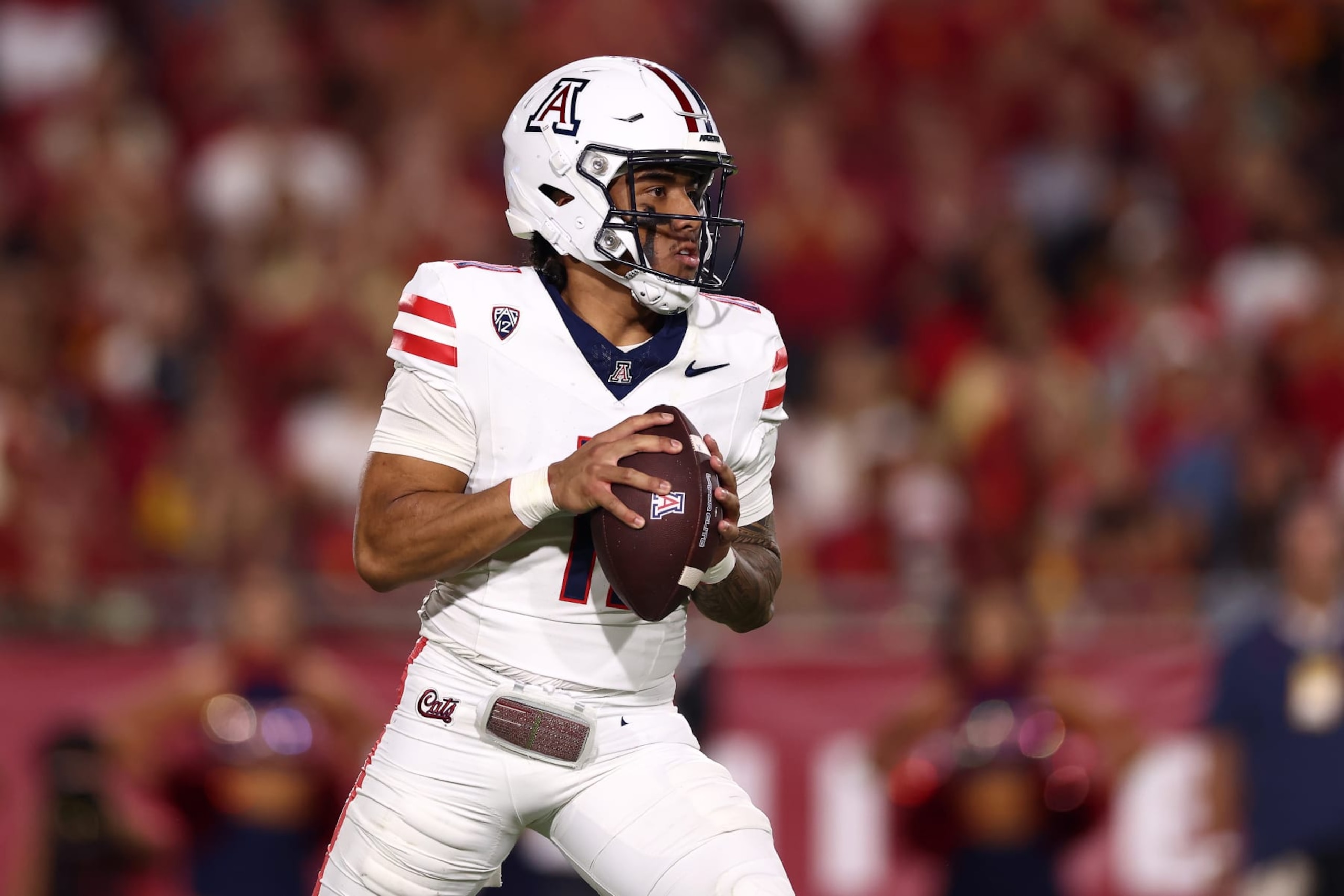LOS ANGELES, CALIFORNIA - OCTOBER 07: Noah Fifita #11 of the Arizona Wildcats passes the ball during the first quarter against the USC Trojans at United Airlines Field at the Los Angeles Memorial Coliseum on October 07, 2023 in Los Angeles, California. (Photo by Katelyn Mulcahy/Getty Images)
