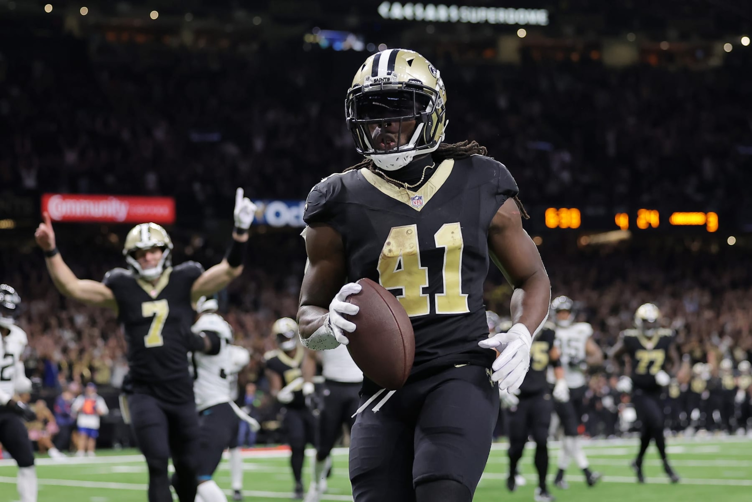NEW ORLEANS, LOUISIANA - OCTOBER 19: Alvin Kamara #41 of the New Orleans Saints crosses the goal line for a two point conversion against the Jacksonville Jaguars during the fourth quarter at Caesars Superdome on October 19, 2023 in New Orleans, Louisiana. (Photo by Jonathan Bachman/Getty Images)