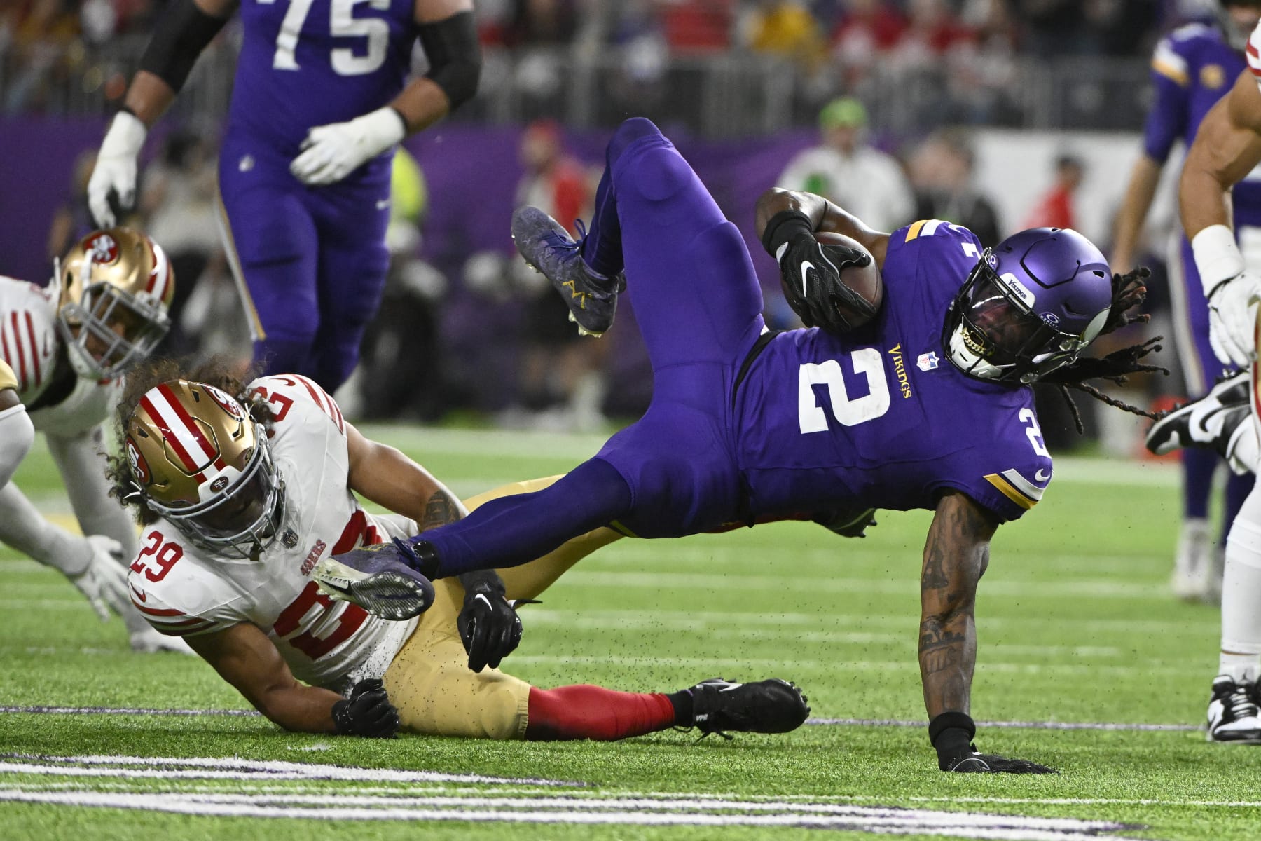 MINNEAPOLIS, MINNESOTA - OCTOBER 23: Alexander Mattison #2 of the Minnesota Vikings battles for yards against Talanoa Hufanga #29 of the San Francisco 49ers during a first half run at U.S. Bank Stadium on October 23, 2023 in Minneapolis, Minnesota. (Photo by Stephen Maturen/Getty Images)