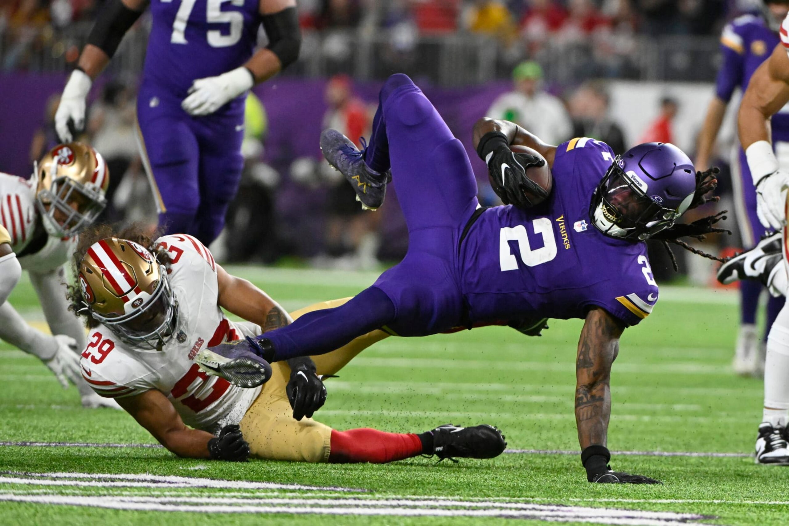 MINNEAPOLIS, MINNESOTA - OCTOBER 23: Alexander Mattison #2 of the Minnesota Vikings battles for yards against Talanoa Hufanga #29 of the San Francisco 49ers during a first half run at U.S. Bank Stadium on October 23, 2023 in Minneapolis, Minnesota. (Photo by Stephen Maturen/Getty Images)