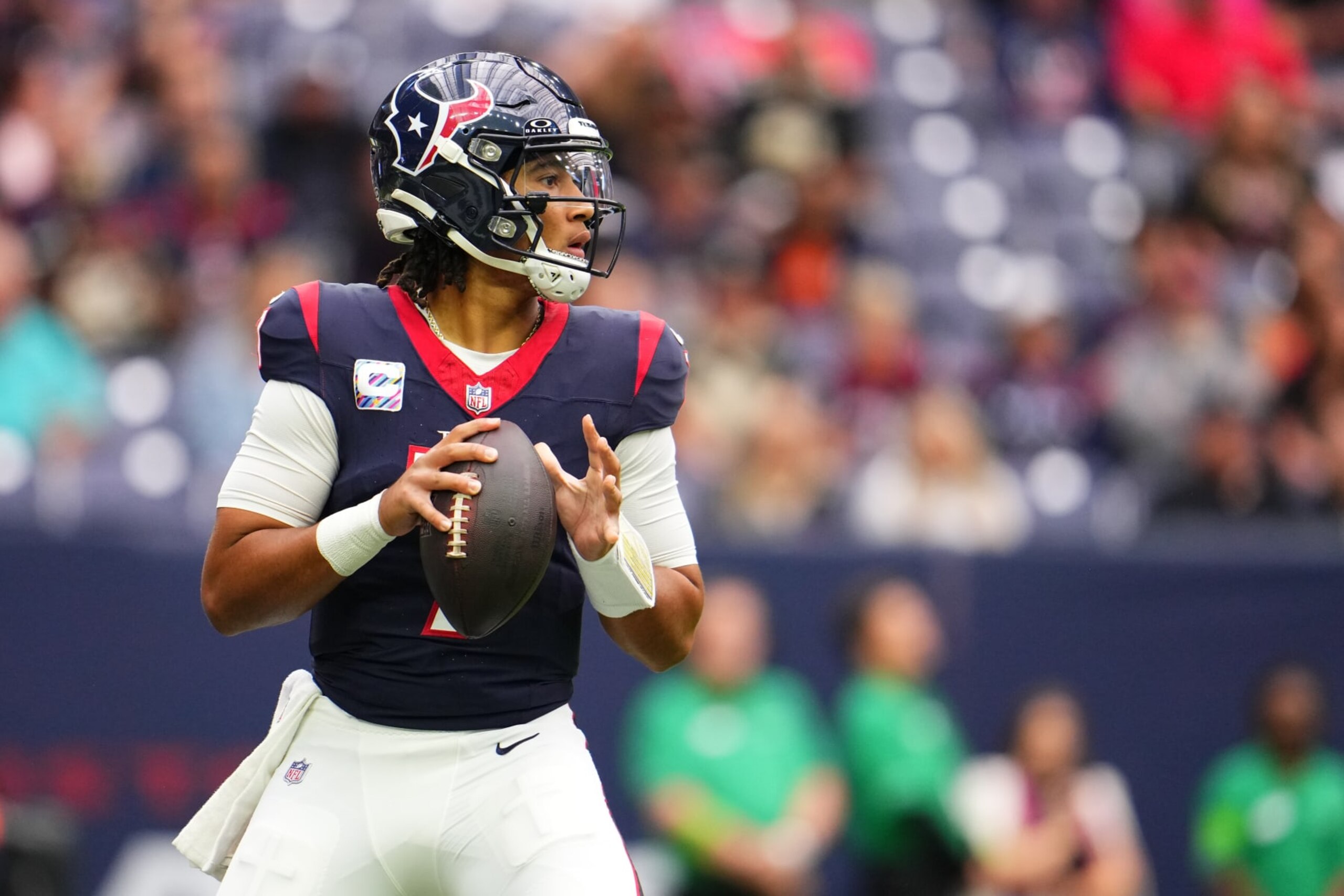 HOUSTON, TX - OCTOBER 15: C.J. Stroud #7 of the Houston Texans drops back to pass against the New Orleans Saints during the first half at NRG Stadium on October 15, 2023 in Houston, Texas. (Photo by Cooper Neill/Getty Images)