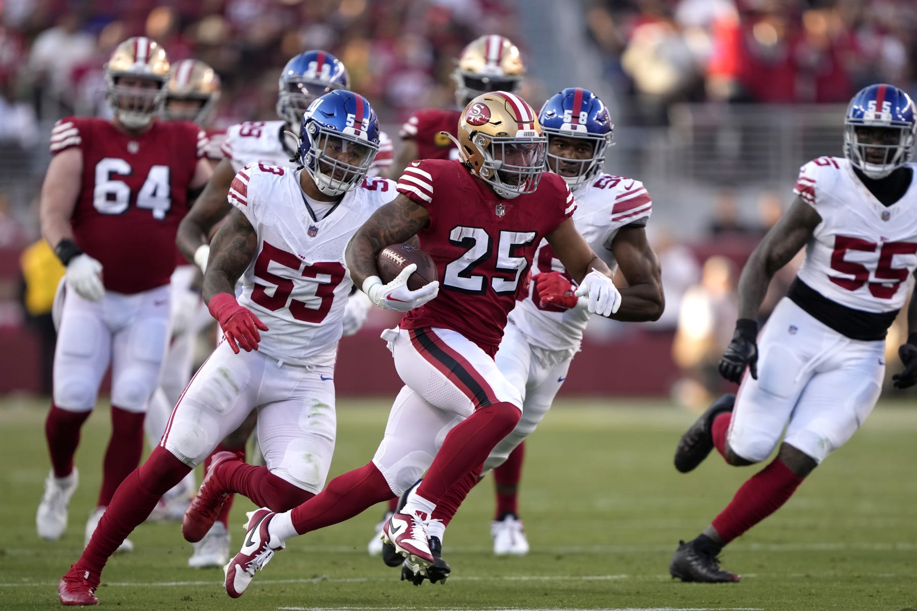 SANTA CLARA, CALIFORNIA - SEPTEMBER 21: Elijah Mitchell #25 of the San Francisco 49ers runs the ball against the New York Giants during the second quarter in the game at Levi's Stadium on September 21, 2023 in Santa Clara, California. (Photo by Thearon W. Henderson/Getty Images)