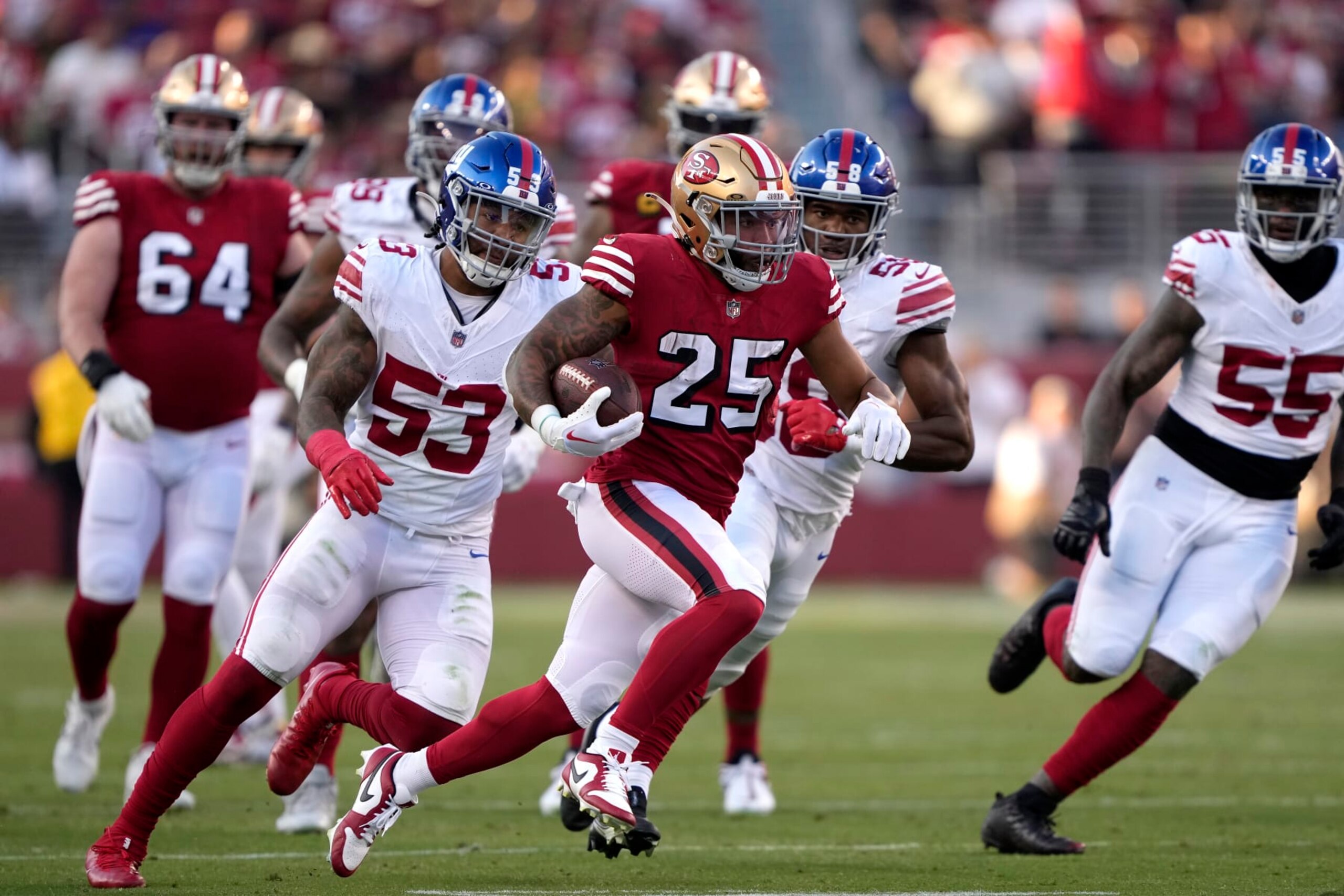 SANTA CLARA, CALIFORNIA - SEPTEMBER 21: Elijah Mitchell #25 of the San Francisco 49ers runs the ball against the New York Giants during the second quarter in the game at Levi's Stadium on September 21, 2023 in Santa Clara, California. (Photo by Thearon W. Henderson/Getty Images)