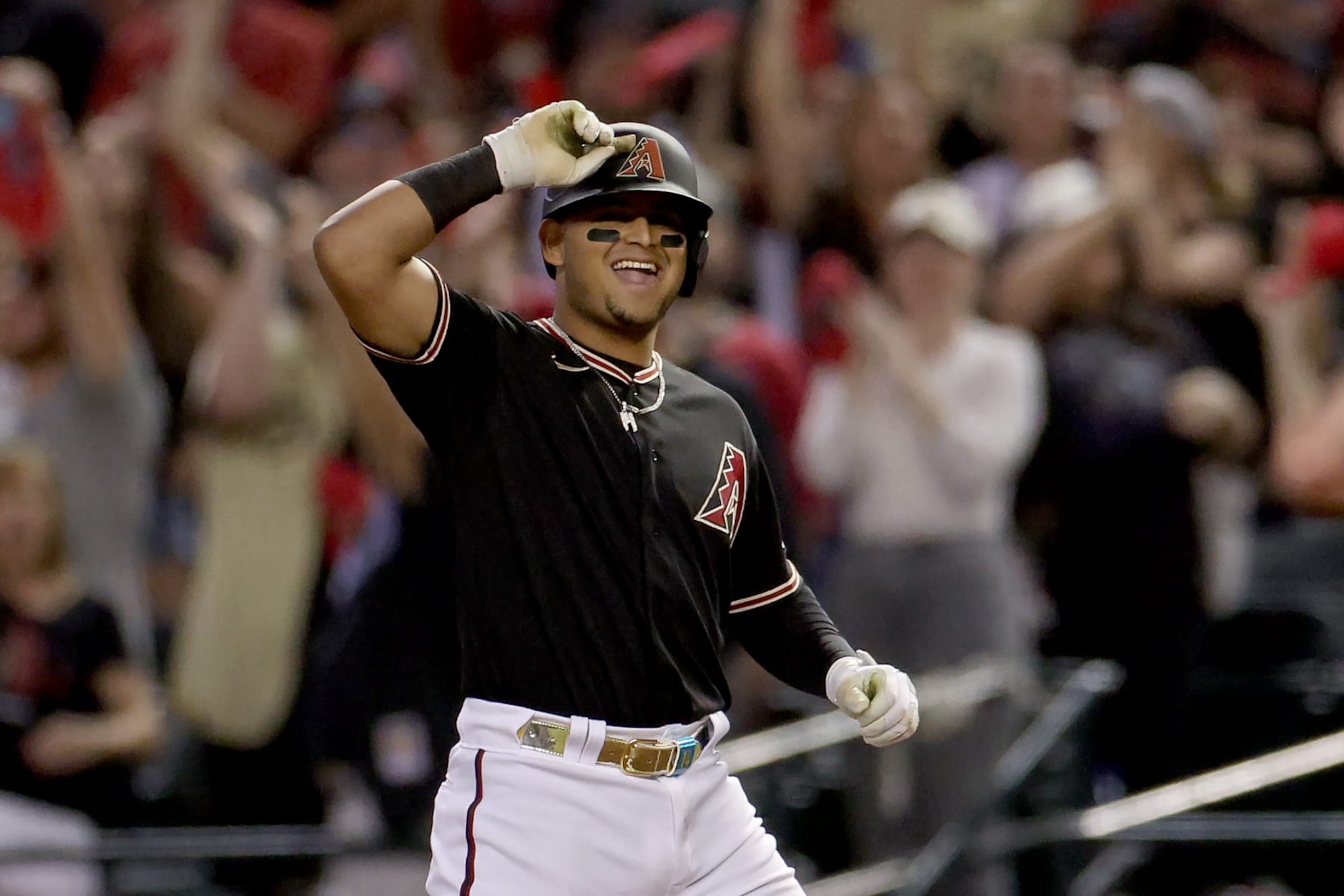 PHOENIX, ARIZONA - OCTOBER 20: Gabriel Moreno #14 of the Arizona Diamondbacks reacts after his RBI single against the Philadelphia Phillies in the third inning during Game Four of the National League Championship Series at Chase Field on October 20, 2023 in Phoenix, Arizona. (Photo by Harry How/Getty Images)
