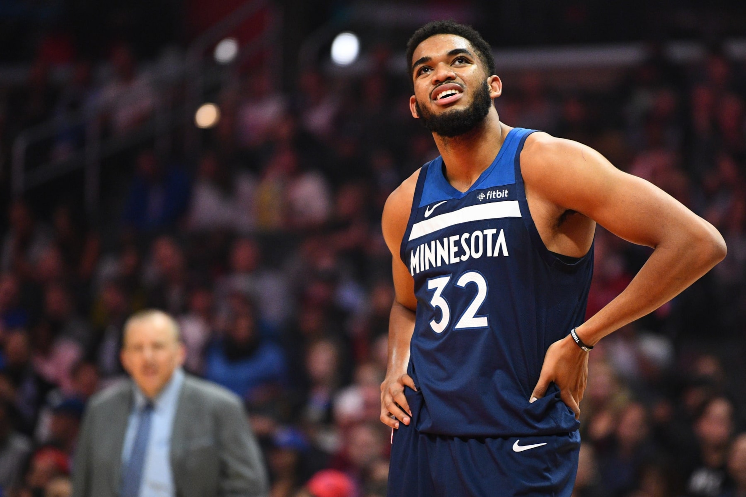 LOS ANGELES, CA - NOVEMBER 05: Minnesota Timberwolves Center Karl-Anthony Towns (32) looks on with head coach Tom Thibodeau in the background during a NBA game between the Minnesota Timberwolves and the Los Angeles Clippers on November 5, 2018 at STAPLES Center in Los Angeles, CA. (Photo by Brian Rothmuller/Icon Sportswire via Getty Images)