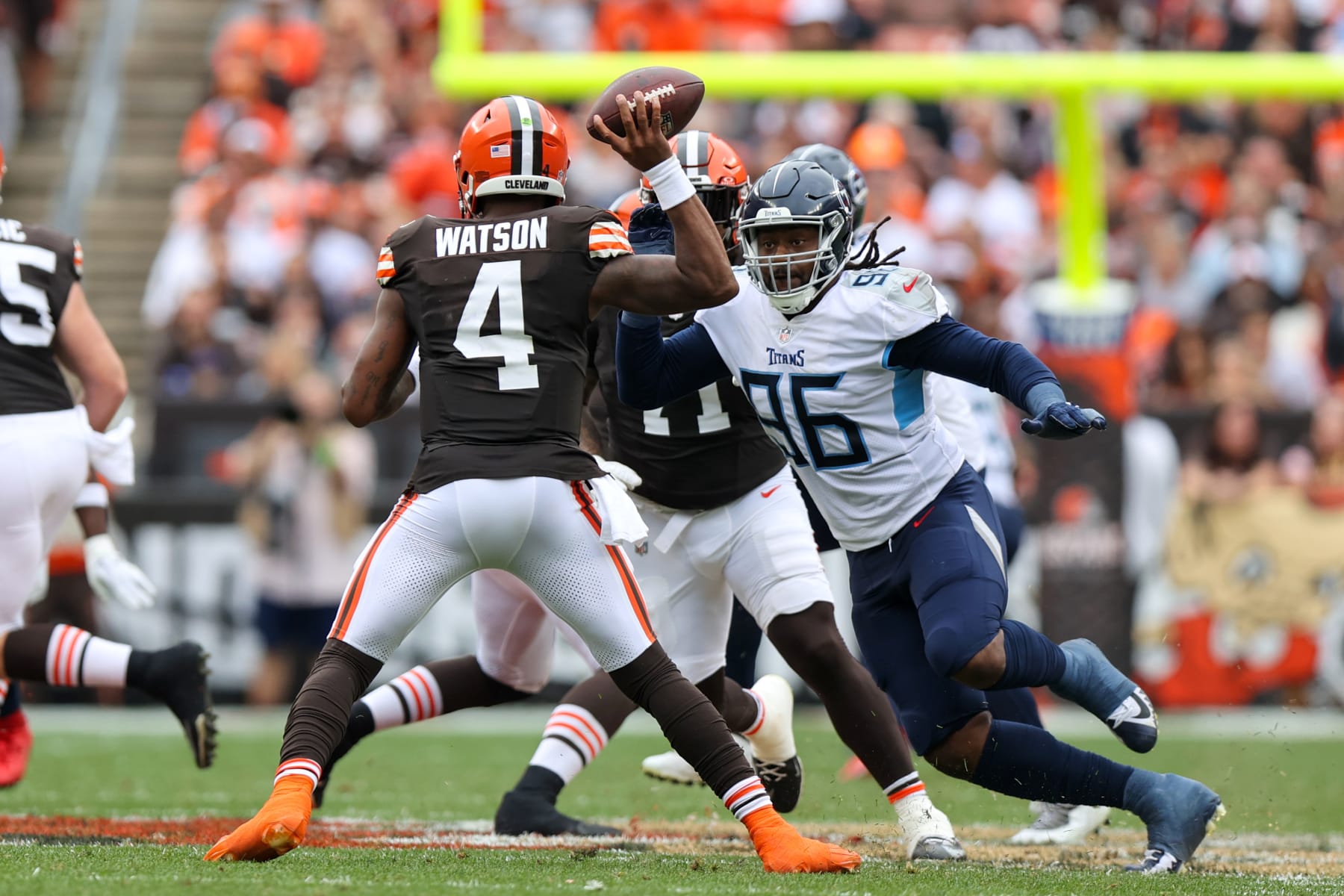 CLEVELAND, OH - SEPTEMBER 24: Cleveland Browns quarterback Deshaun Watson (4) throws a pass as Tennessee Titans defensive end Denico Autry (96) applies pressure during the third quarter of the National Football League game between the Tennessee Titans and Cleveland Browns on September 24, 2023, at Cleveland Browns Stadium in Cleveland, OH. (Photo by Frank Jansky/Icon Sportswire via Getty Images)