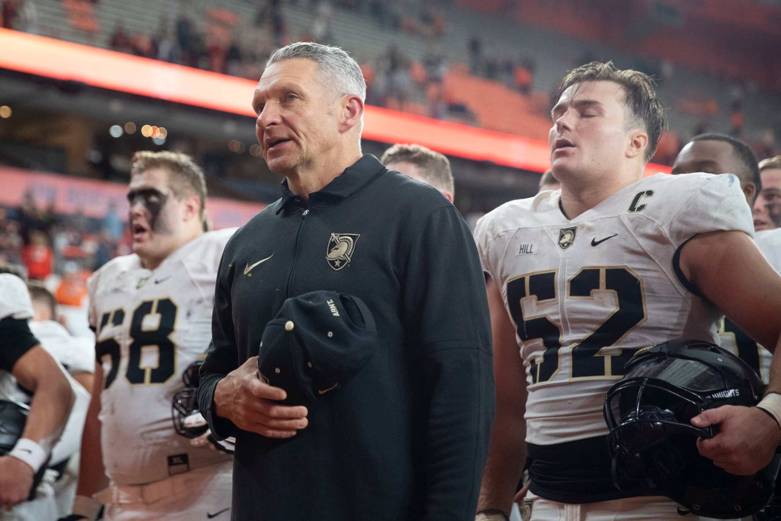 SYRACUSE, NEW YORK - SEPTEMBER 23: Head coach Jeff Monken of the Army Black Knights sings the Alma Mater after the game against Syracuse at JMA Wireless Dome on September 23, 2023 in Syracuse, New York. (Photo by Edward Diller/Getty Images)