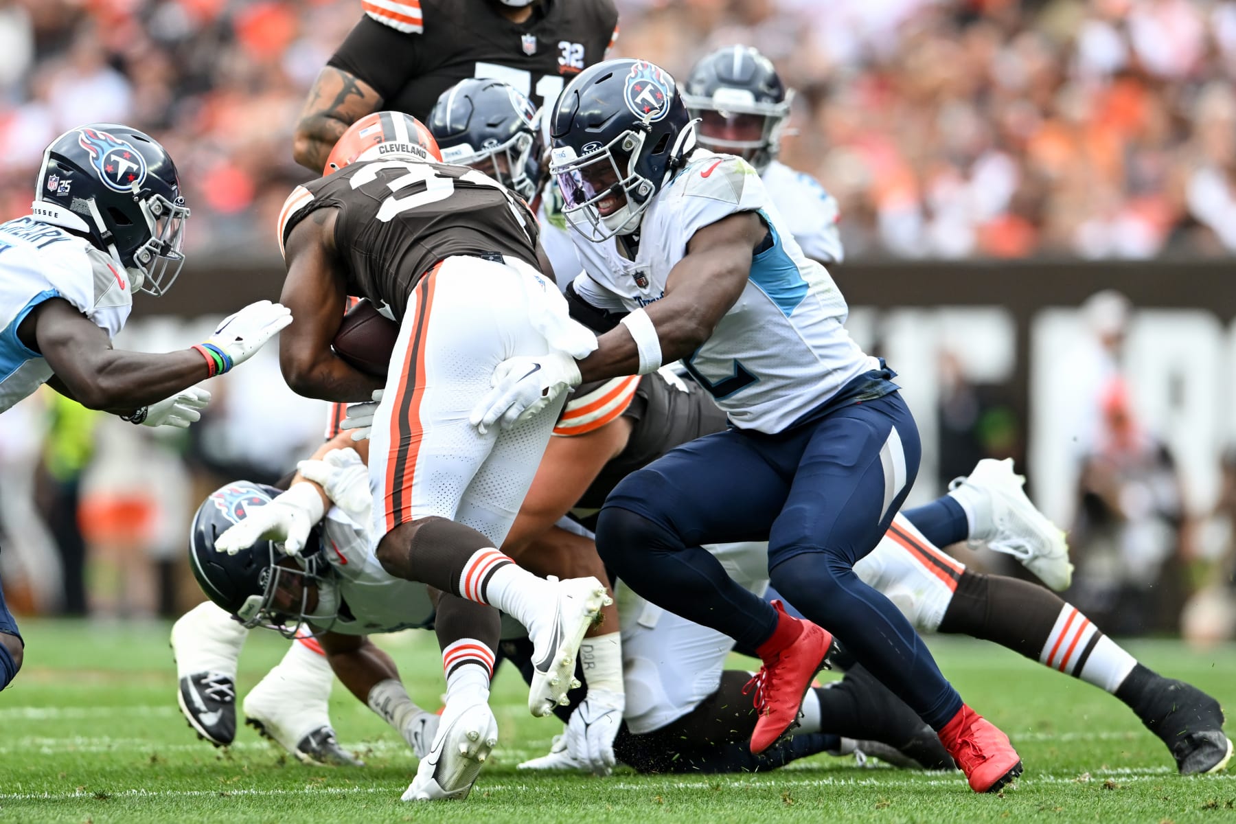 CLEVELAND, OHIO - SEPTEMBER 24: Azeez Al-Shaair #2 of the Tennessee Titans tackles Jerome Ford #34 of the Cleveland Browns during the first half at Cleveland Browns Stadium on September 24, 2023 in Cleveland, Ohio. (Photo by Nick Cammett/Diamond Images via Getty Images)