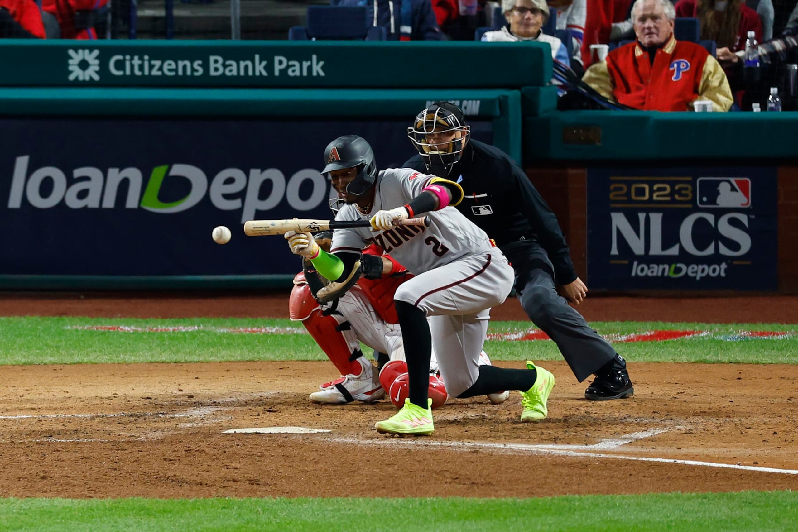 PHILADELPHIA, PENNSYLVANIA - OCTOBER 24: Geraldo Perdomo #2 of the Arizona Diamondbacks hits a sacrifice bunt against the Philadelphia Phillies during the fifth inning in Game Seven of the Championship Series at Citizens Bank Park on October 24, 2023 in Philadelphia, Pennsylvania. (Photo by Rich Schultz/Getty Images)