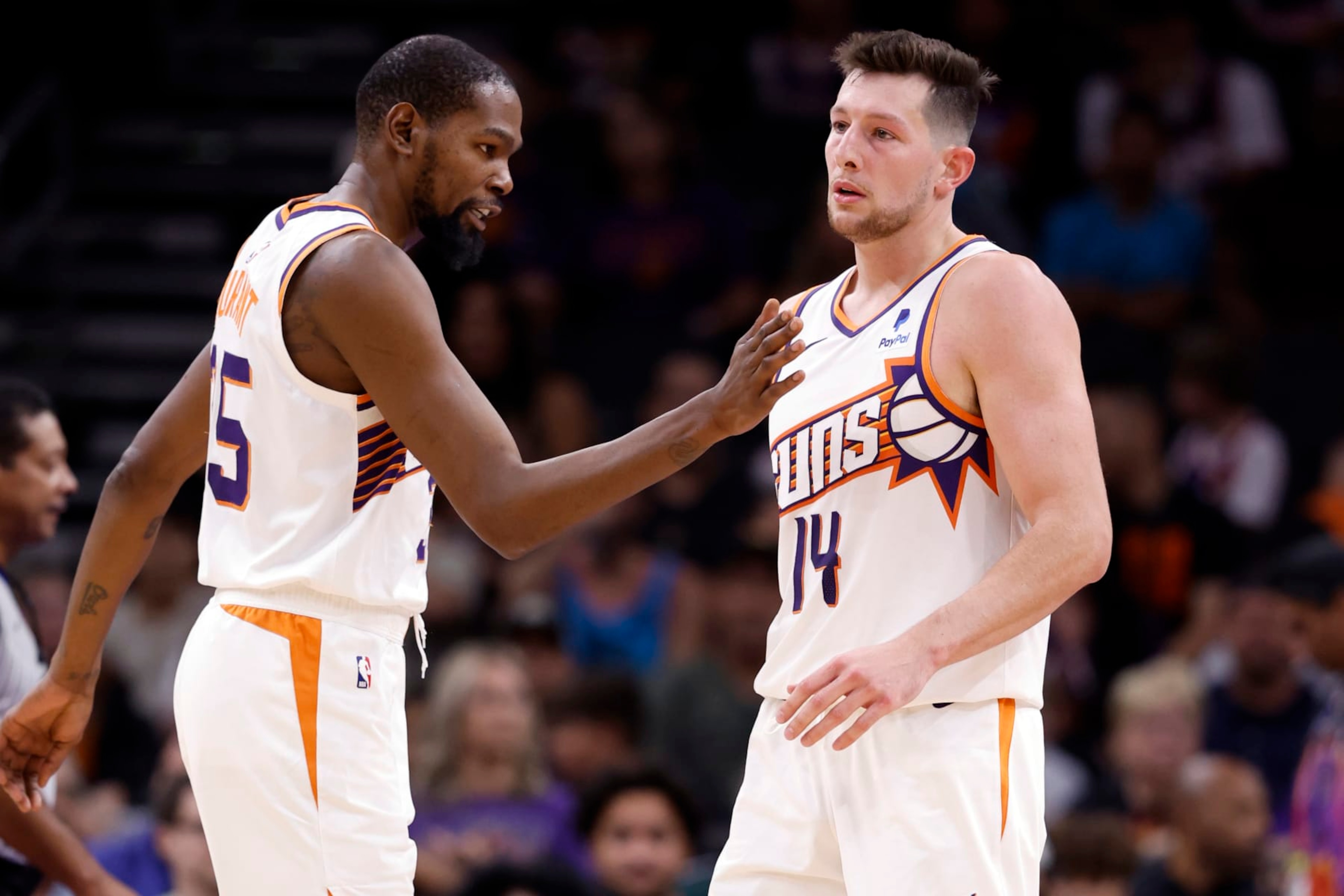 PHOENIX, ARIZONA - OCTOBER 16: Kevin Durant #35 of the Phoenix Suns greets Drew Eubanks #14 during the game against the Portland Trail Blazers at Footprint Center on October 16, 2023 in Phoenix, Arizona. The Suns defeated the Trail Blazers 117-106. NOTE TO USER: User expressly acknowledges and agrees that, by downloading and or using this photograph, User is consenting to the terms and conditions of the Getty Images License Agreement. (Photo by Chris Coduto/Getty Images) PHOENIX, ARIZONA - OCTOBER 16: Kevin Durant #35 of the Phoenix Suns greets Drew Eubanks #14 during the game against the Portland Trail Blazers at Footprint Center on October 16, 2023 in Phoenix, Arizona. The Suns defeated the Trail Blazers 117-106. NOTE TO USER: User expressly acknowledges and agrees that, by downloading and or using this photograph, User is consenting to the terms and conditions of the Getty Images License Agreement. (Photo by Chris Coduto/Getty Images)