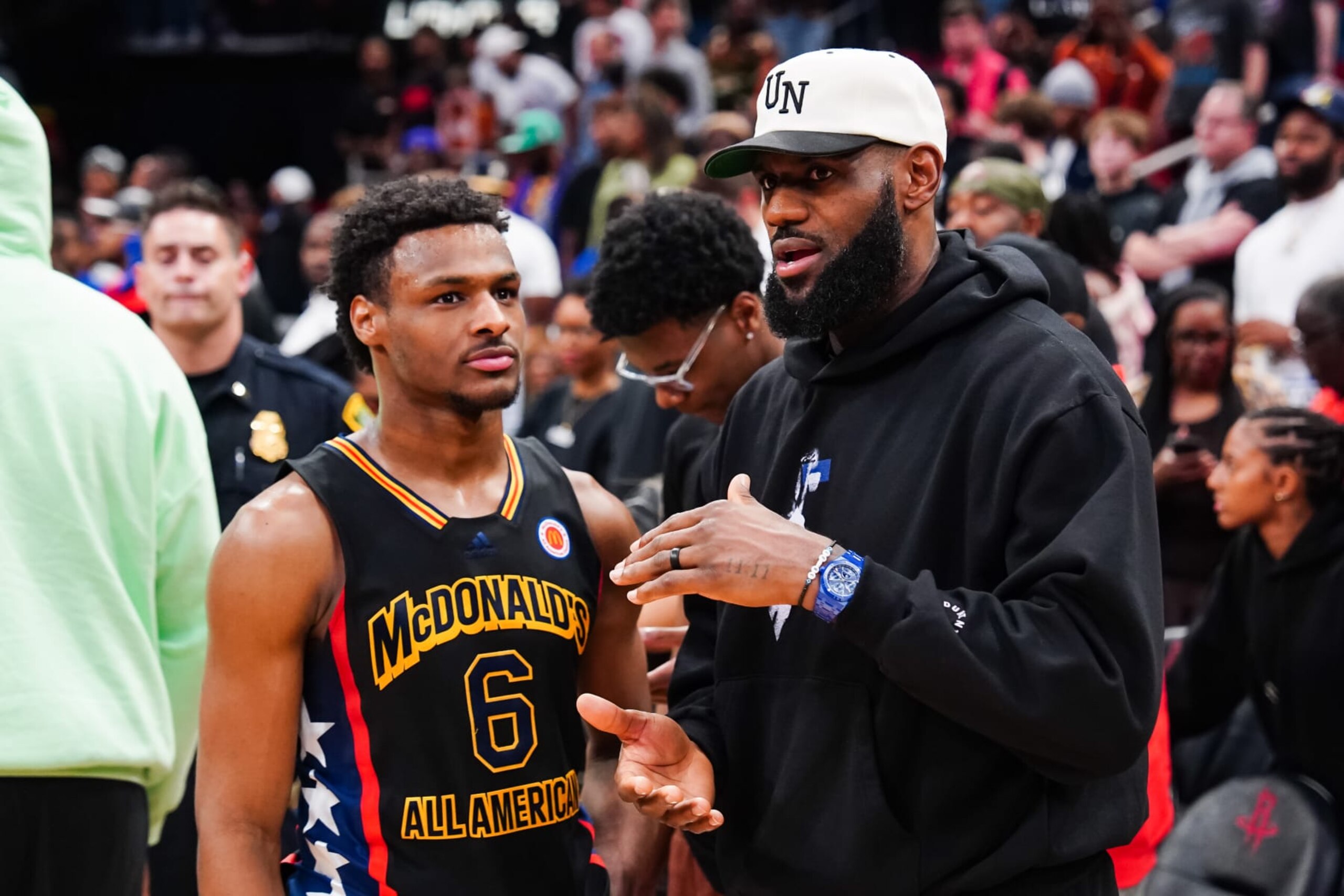 HOUSTON, TEXAS - MARCH 28: Bronny James #6 of the West team talks to Lebron James of the Los Angeles Lakers after the 2023 McDonald's High School Boys All-American Game at Toyota Center on March 28, 2023 in Houston, Texas. (Photo by Alex Bierens de Haan/Getty Images) HOUSTON, TEXAS - MARCH 28: Bronny James #6 of the West team talks to Lebron James of the Los Angeles Lakers after the 2023 McDonald's High School Boys All-American Game at Toyota Center on March 28, 2023 in Houston, Texas. (Photo by Alex Bierens de Haan/Getty Images)