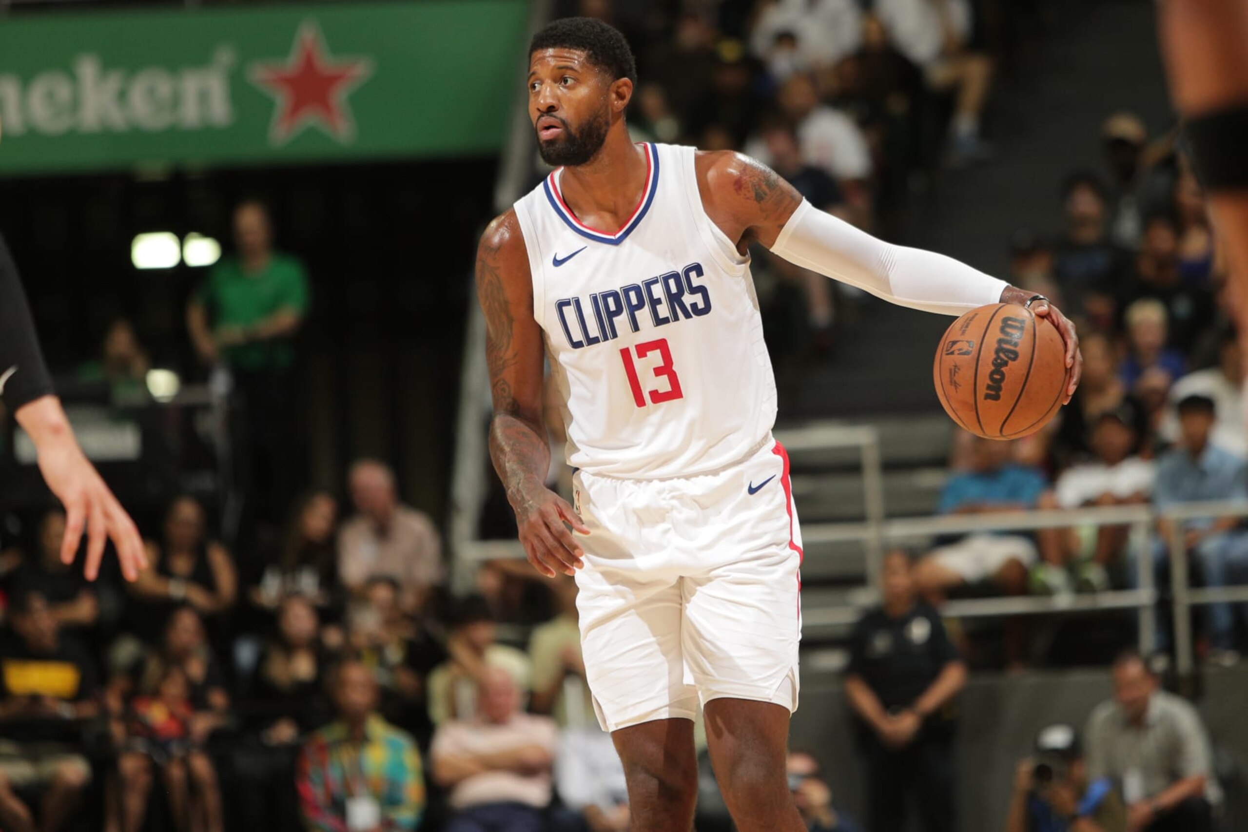 HONOLULU, HI - OCTOBER 8: Paul George #13 of the LA Clippers dribbles the ball during the game against the Utah Jazz on October 8, 2023 at the SimpliFi Arena at the Stan Sheriff Center in Honolulu, Hawaii. NOTE TO USER: User expressly acknowledges and agrees that, by downloading and or using this photograph, User is consenting to the terms and conditions of the Getty Images License Agreement. Mandatory Copyright Notice: Copyright 2023 NBAE (Photo by Jay Metzger/NBAE via Getty Images) HONOLULU, HI - OCTOBER 8: Paul George #13 of the LA Clippers dribbles the ball during the game against the Utah Jazz on October 8, 2023 at the SimpliFi Arena at the Stan Sheriff Center in Honolulu, Hawaii. NOTE TO USER: User expressly acknowledges and agrees that, by downloading and or using this photograph, User is consenting to the terms and conditions of the Getty Images License Agreement. Mandatory Copyright Notice: Copyright 2023 NBAE (Photo by Jay Metzger/NBAE via Getty Images)