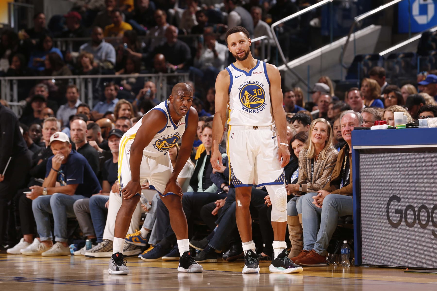 SAN FRANCISCO, CA - OCTOBER 24: Chris Paul #3 and Stephen Curry #30 of the Golden State Warriors looks on during the game against the Phoenix Suns on October 24, 2023 at Chase Center in San Francisco, California. NOTE TO USER: User expressly acknowledges and agrees that, by downloading and or using this photograph, user is consenting to the terms and conditions of Getty Images License Agreement. Mandatory Copyright Notice: Copyright 2023 NBAE (Photo by Jed Jacobsohn/NBAE via Getty Images)