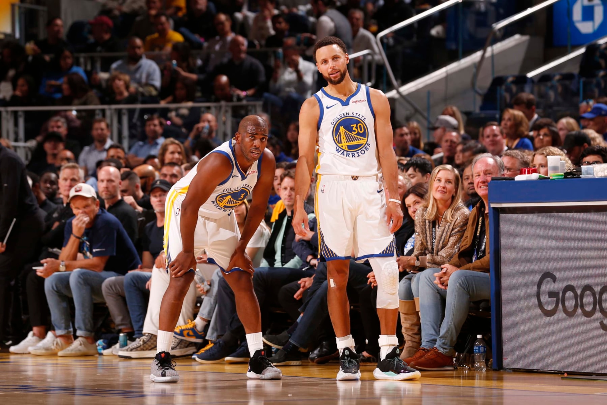 SAN FRANCISCO, CA - OCTOBER 24: Chris Paul #3 and Stephen Curry #30 of the Golden State Warriors looks on during the game against the Phoenix Suns on October 24, 2023 at Chase Center in San Francisco, California. NOTE TO USER: User expressly acknowledges and agrees that, by downloading and or using this photograph, user is consenting to the terms and conditions of Getty Images License Agreement. Mandatory Copyright Notice: Copyright 2023 NBAE (Photo by Jed Jacobsohn/NBAE via Getty Images)
