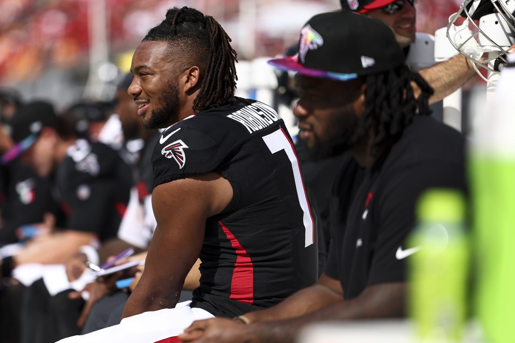 TAMPA, FL - OCTOBER 22: Bijan Robinson #7 of the Atlanta Falcons smiles on the bench during the third quarter of an NFL football game against the Tampa Bay Buccaneers at Raymond James Stadium on October 22, 2023 in Tampa, Florida. (Photo by Kevin Sabitus/Getty Images)