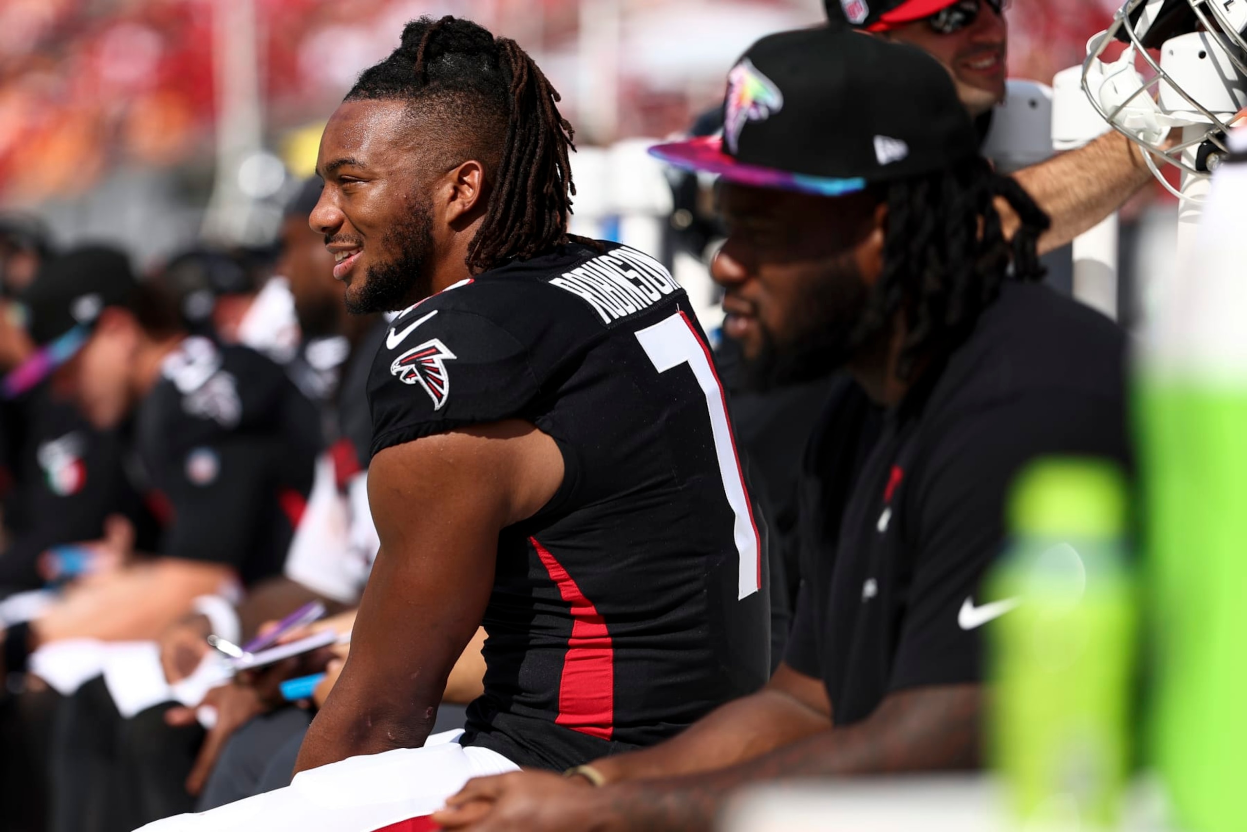TAMPA, FL - OCTOBER 22: Bijan Robinson #7 of the Atlanta Falcons smiles on the bench during the third quarter of an NFL football game against the Tampa Bay Buccaneers at Raymond James Stadium on October 22, 2023 in Tampa, Florida. (Photo by Kevin Sabitus/Getty Images)